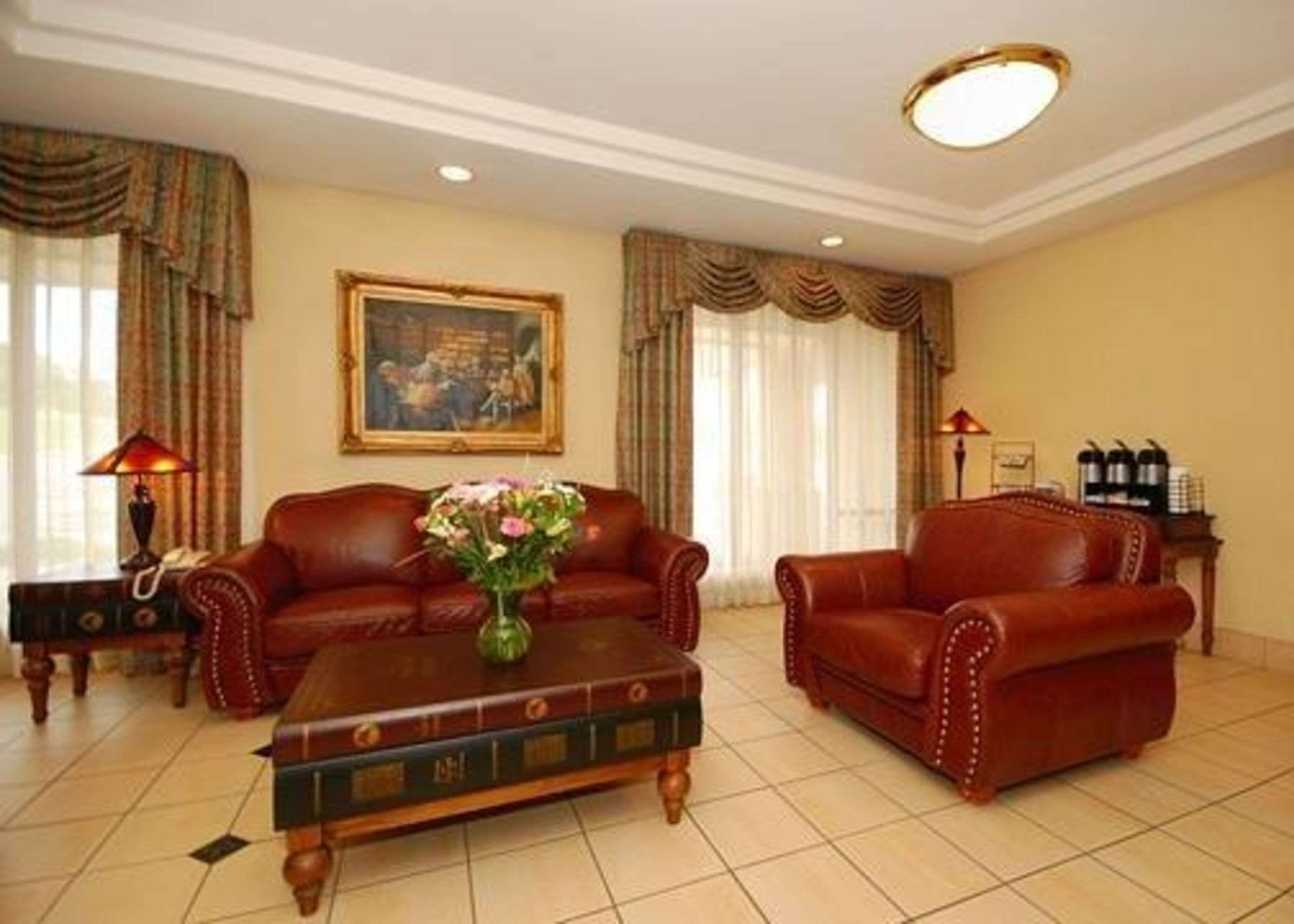 Spacious lobby with sitting area | Quality Inn & Suites
