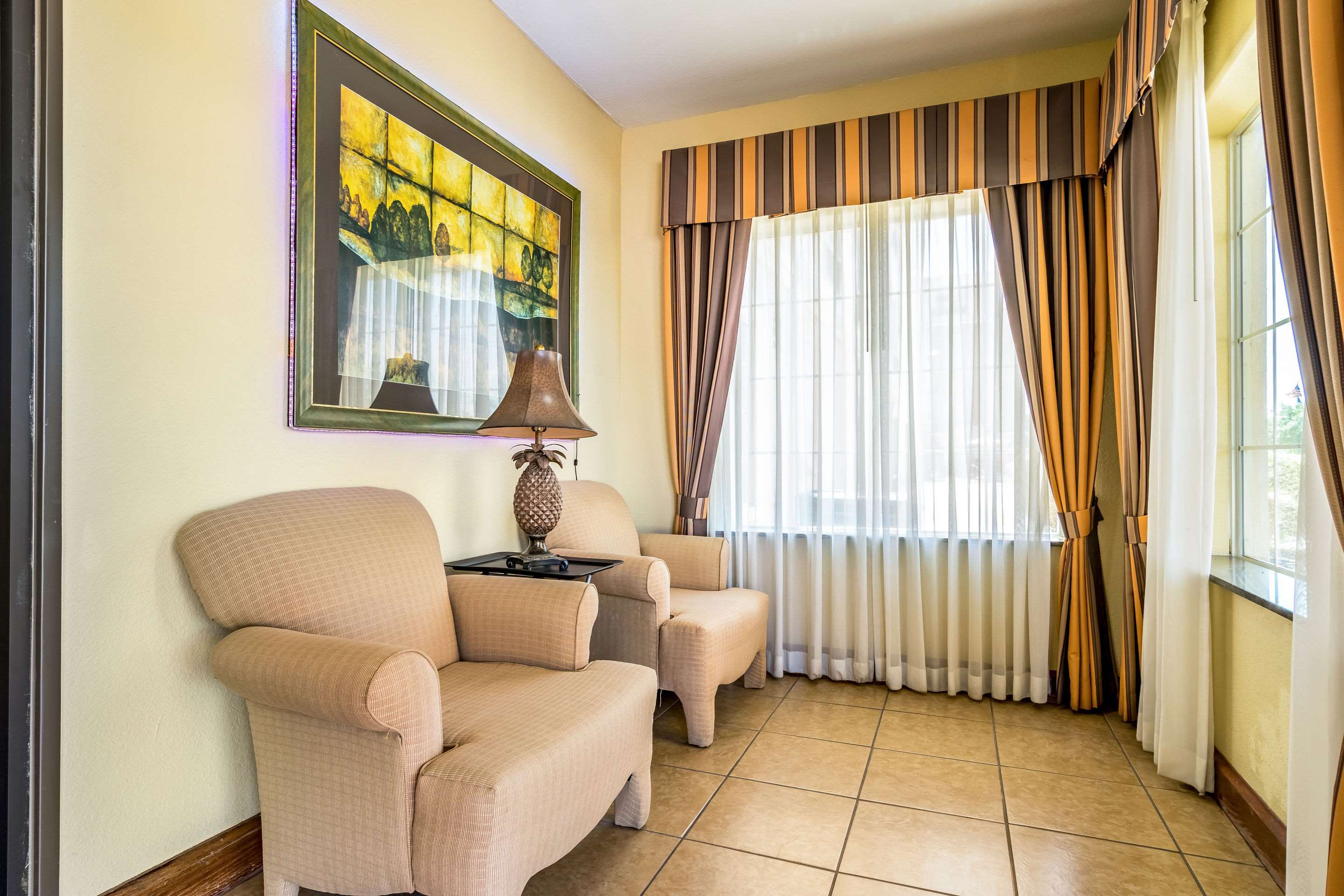 Lobby with sitting area | AmericInn by Wyndham New Braunfels
