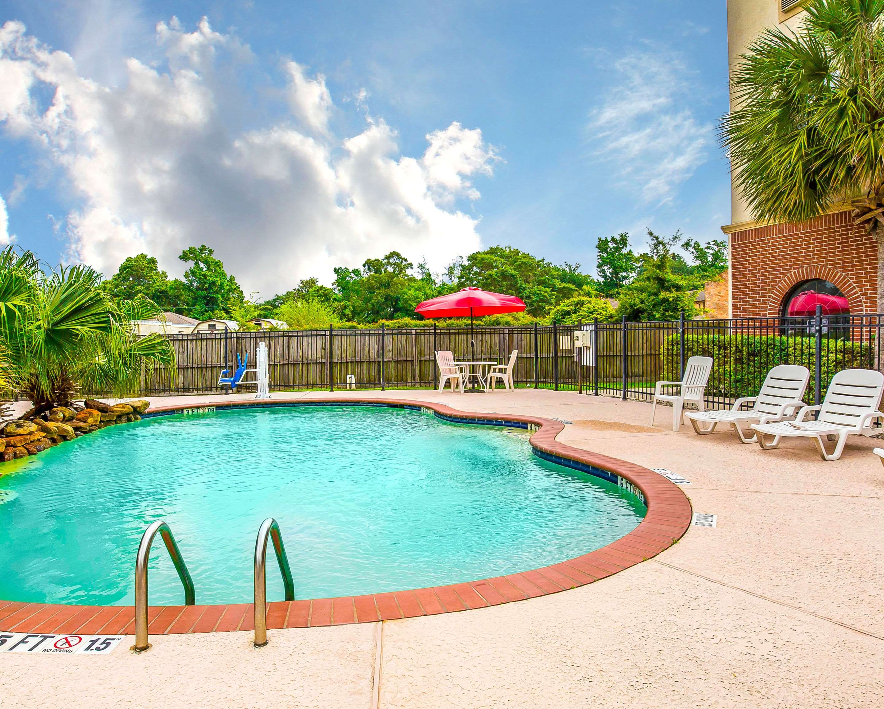 Outdoor pool | Econo Lodge Inn & Suites Beaumont
