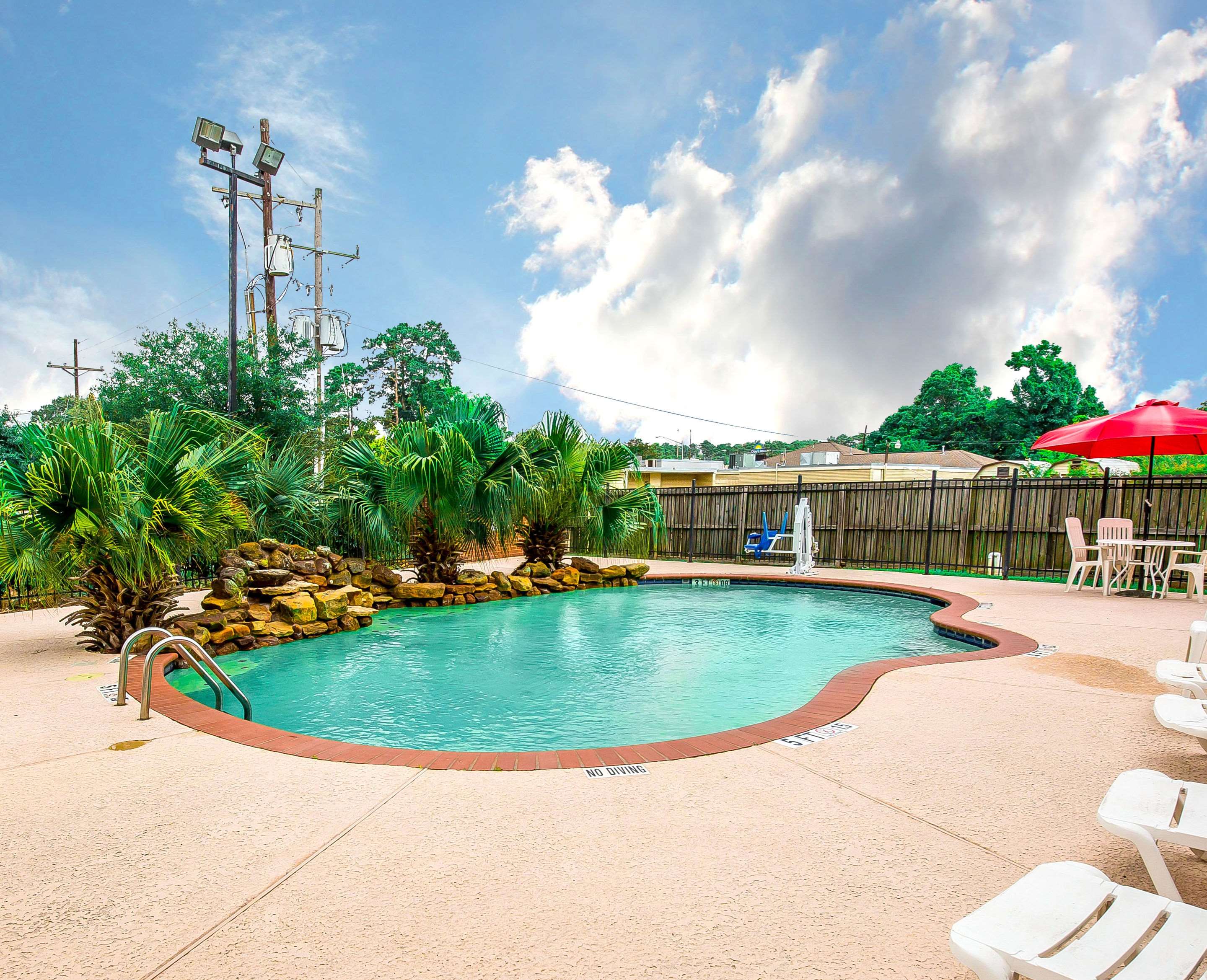 Outdoor pool | Econo Lodge Inn & Suites Beaumont