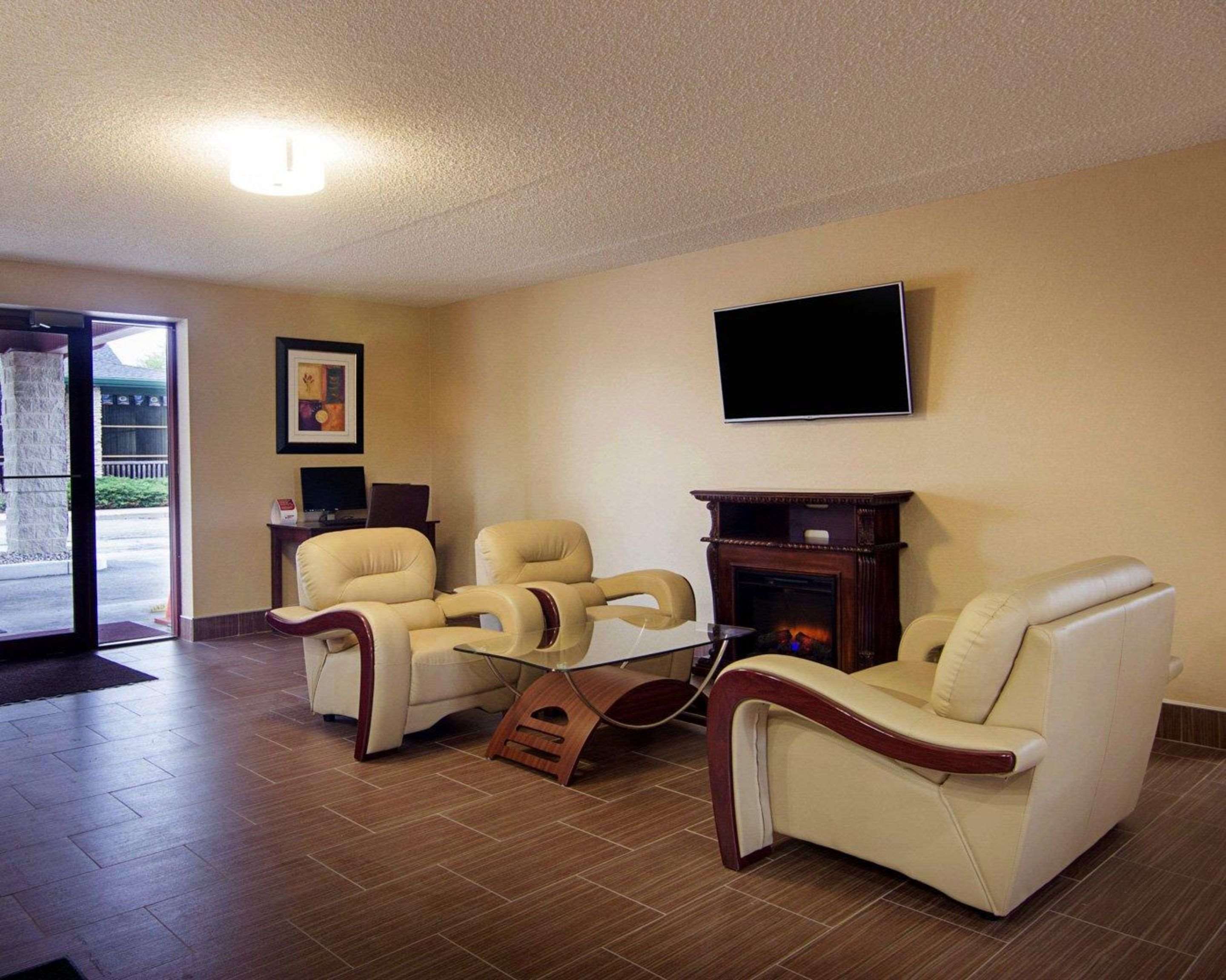 Relax by the fireplace in the lobby | Quality Inn -Sturtevant