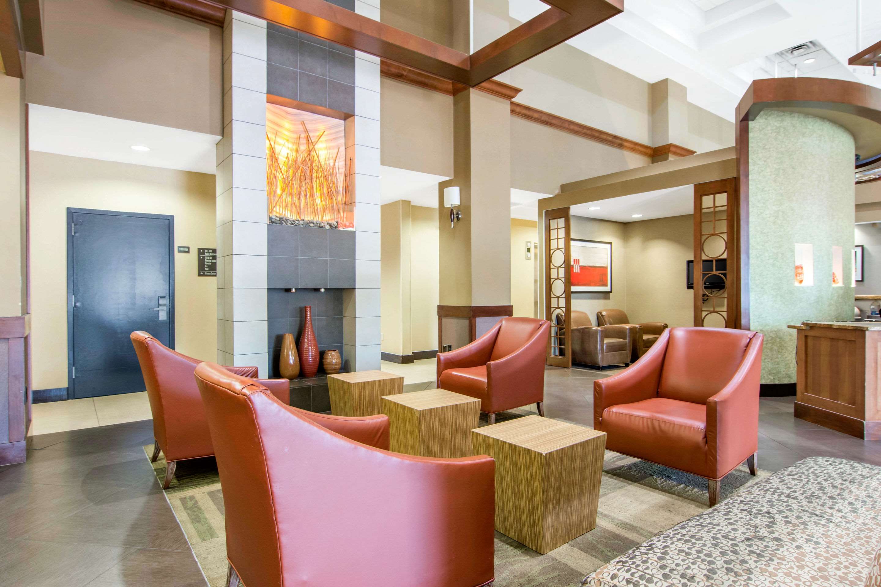 Spacious lobby with sitting area | AmericInn by Wyndham Stonecrest near Atlanta