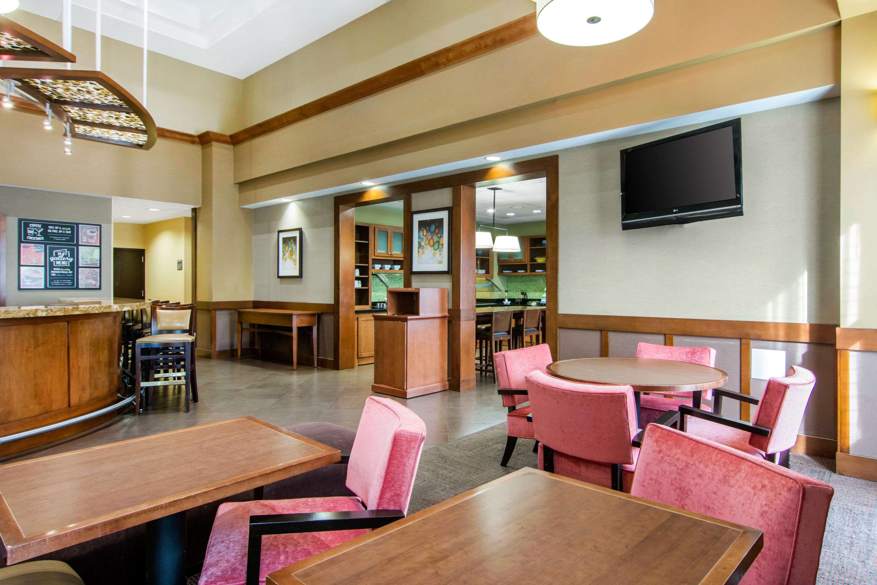 Enjoy breakfast in this seating area | AmericInn by Wyndham Stonecrest near Atlanta
