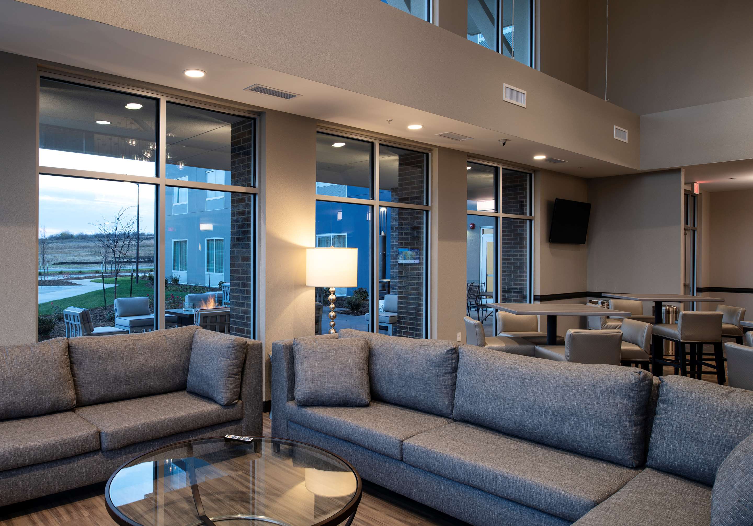Relax in our spacious lounge area | StoneHill Lawrence, Trademark Collection by Wyndham