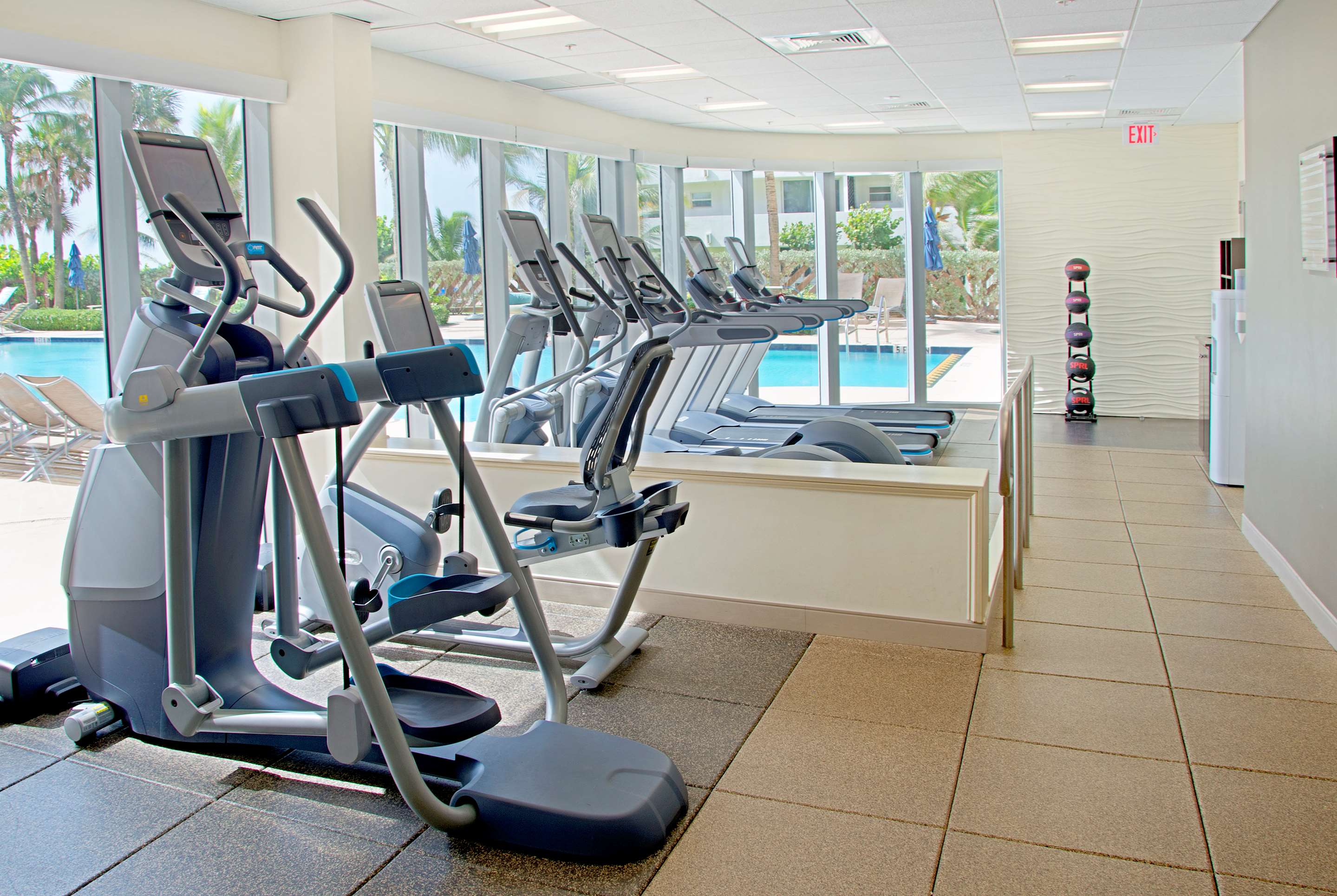 Health club fitness center gym | The Singer Oceanfront Resort, Curio Collection by Hilton