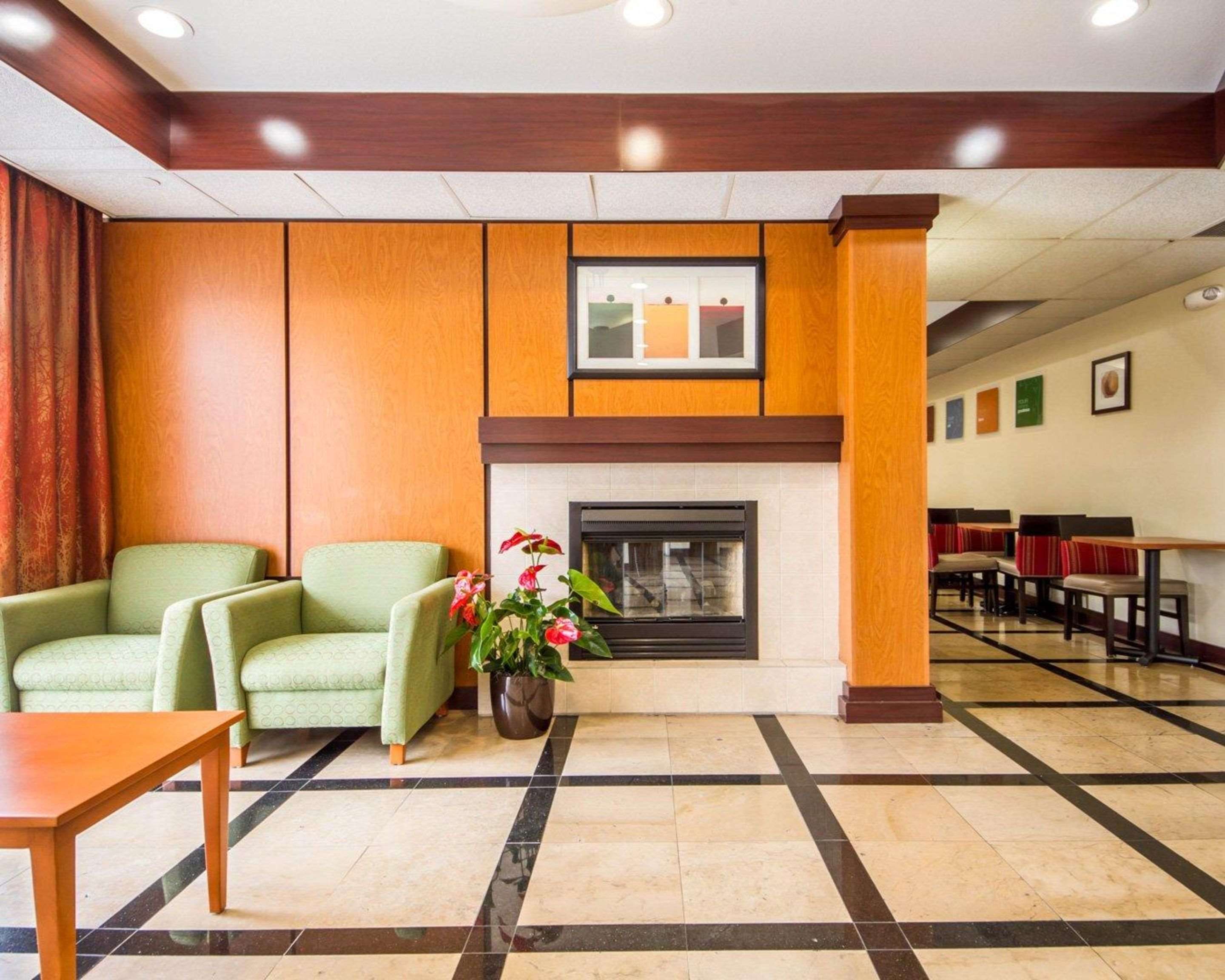 Relax by the fireplace in the lobby | Comfort Inn & Suites Oakland