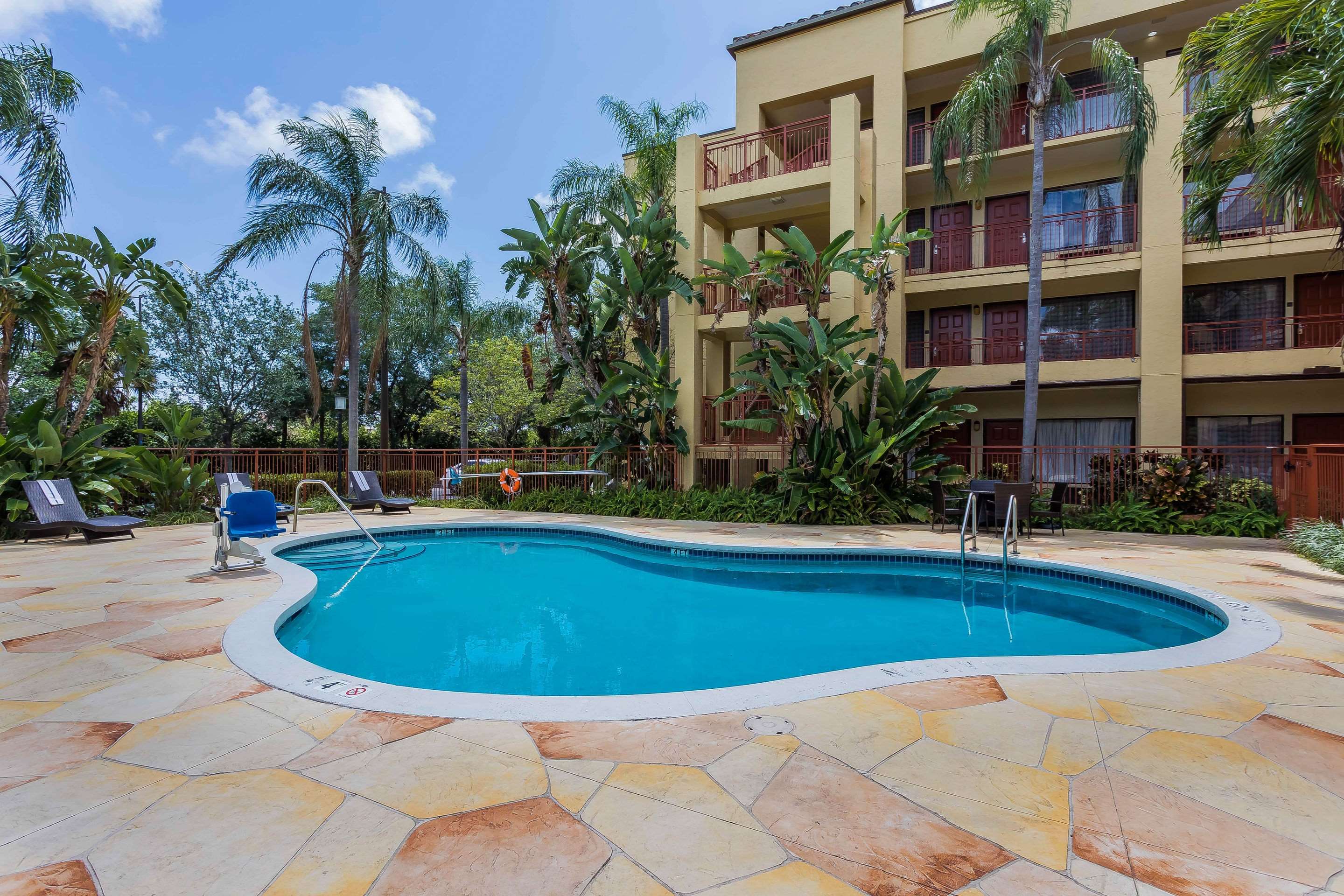 Relax by the pool | Boca Suites Deerfield Beach