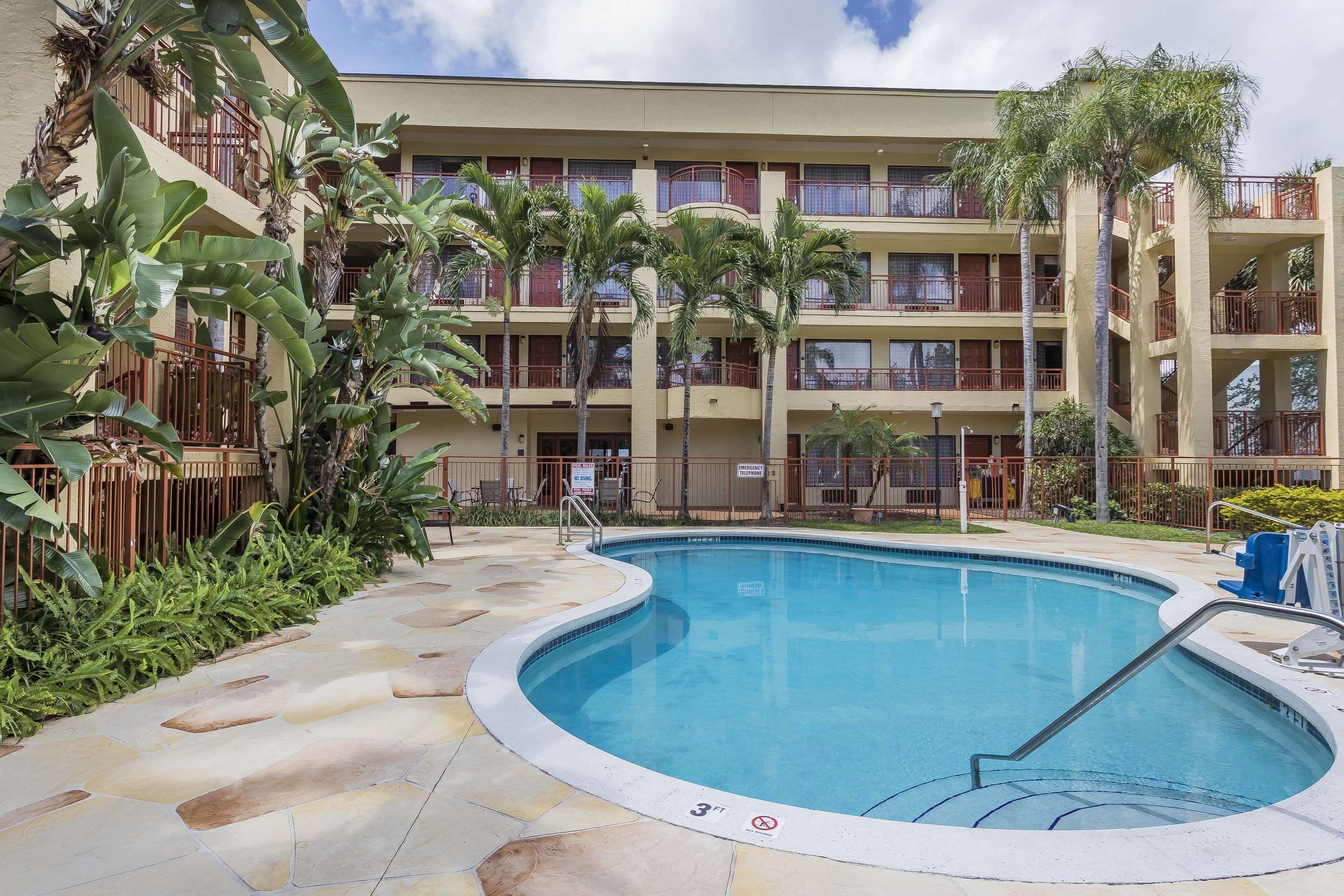 Relax by the pool | Boca Suites Deerfield Beach