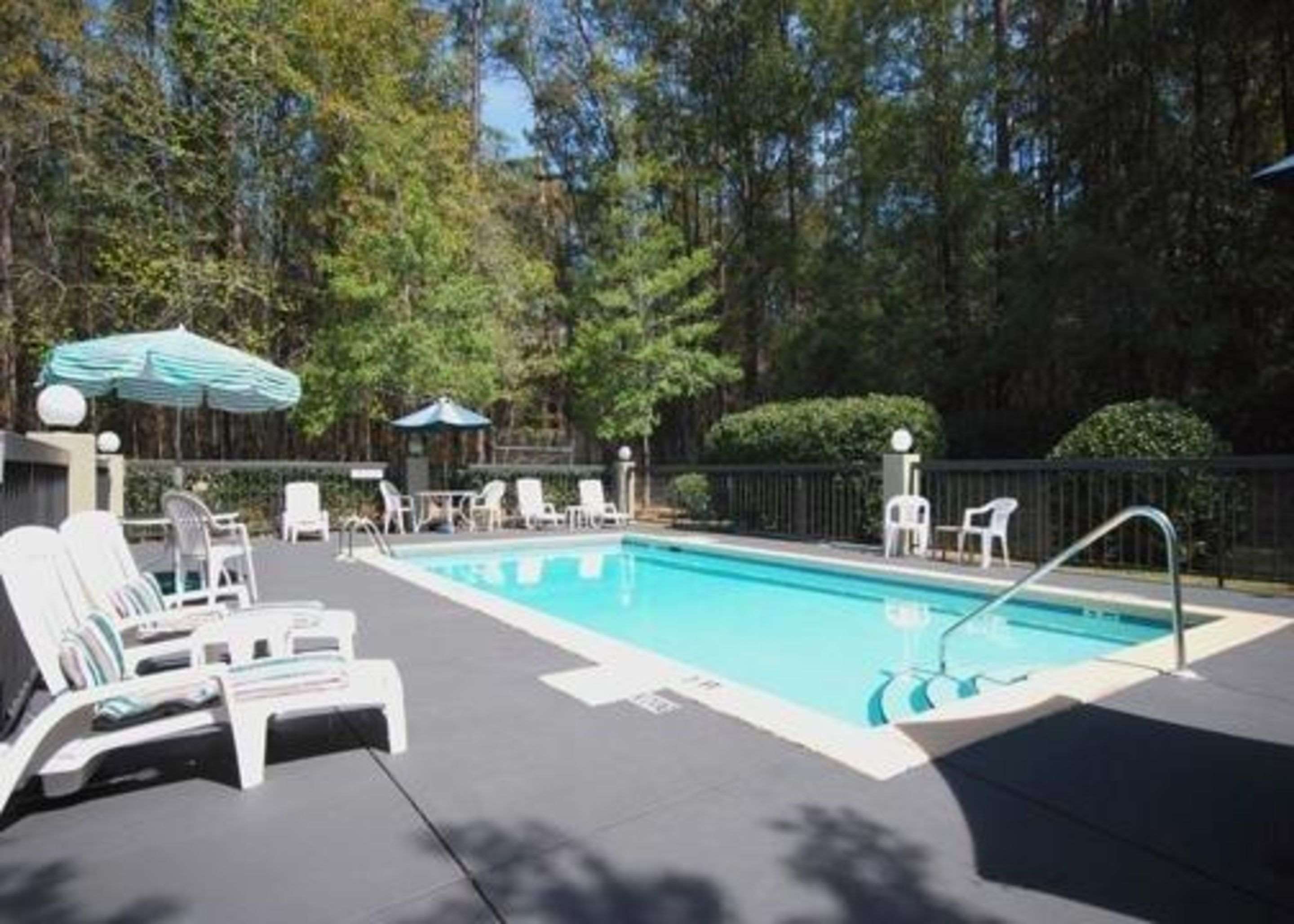 Outdoor pool with sundeck | Sleep Inn Tallahassee-University Area