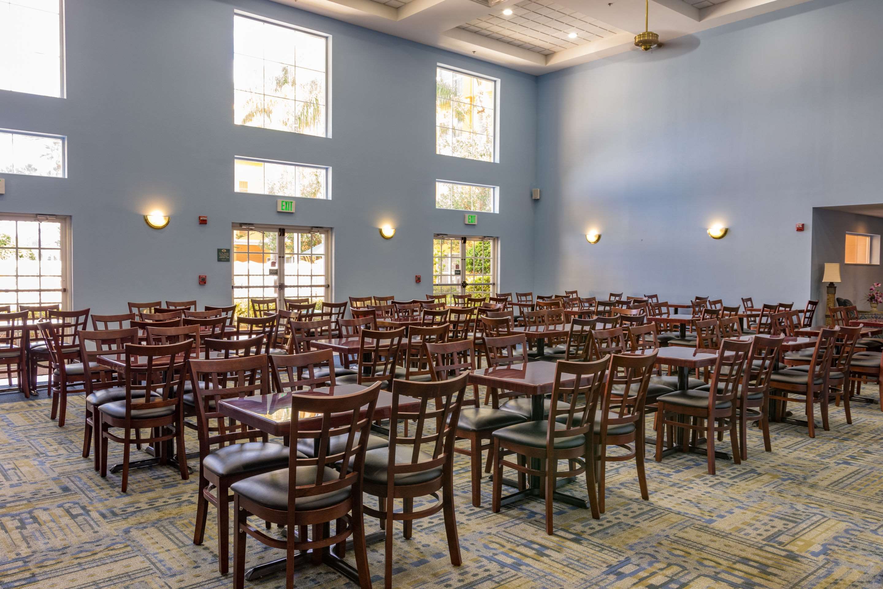 Enjoy breakfast in this seating area | Quality Suites Lake Buena Vista