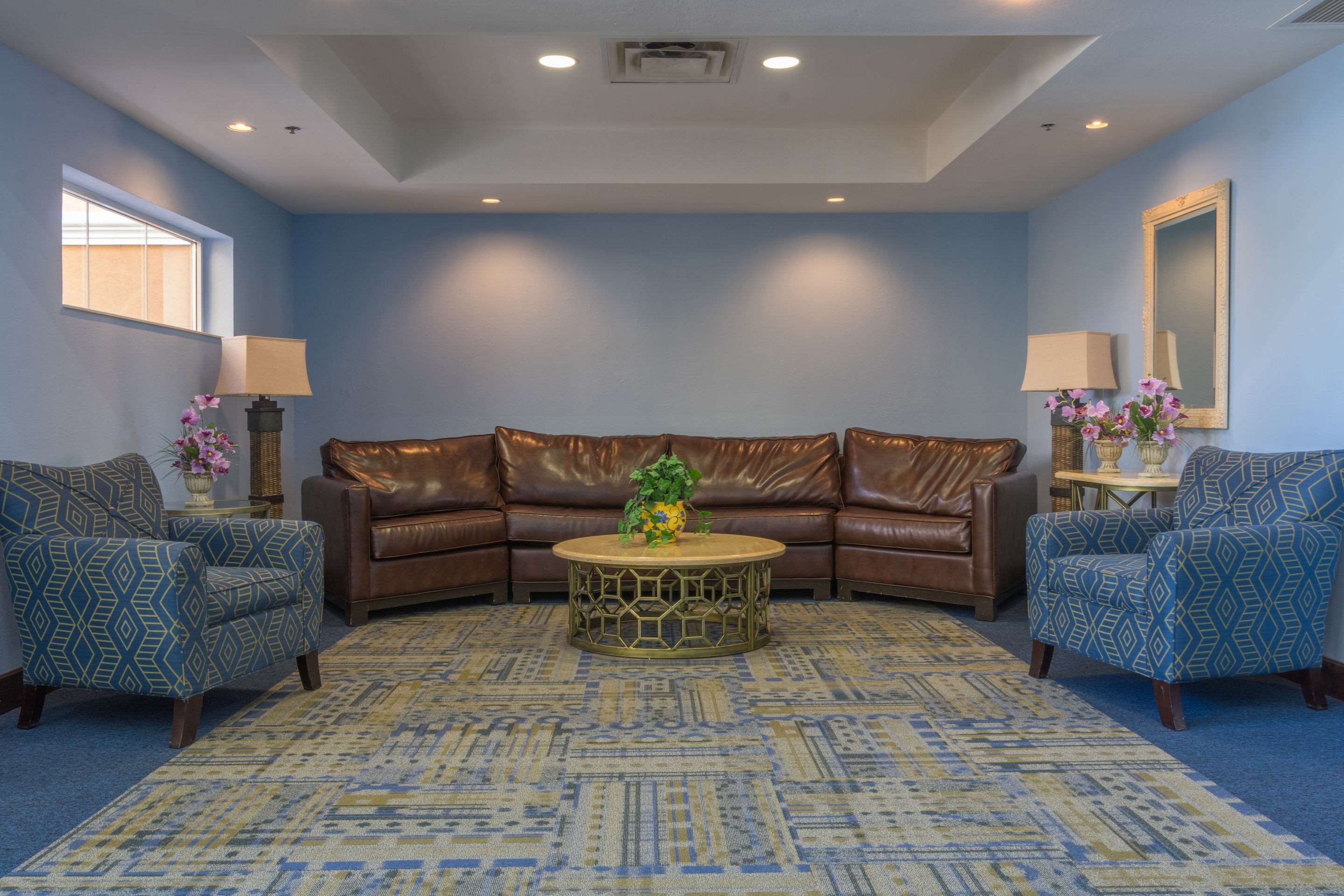 Spacious lobby with sitting area | Quality Suites Lake Buena Vista