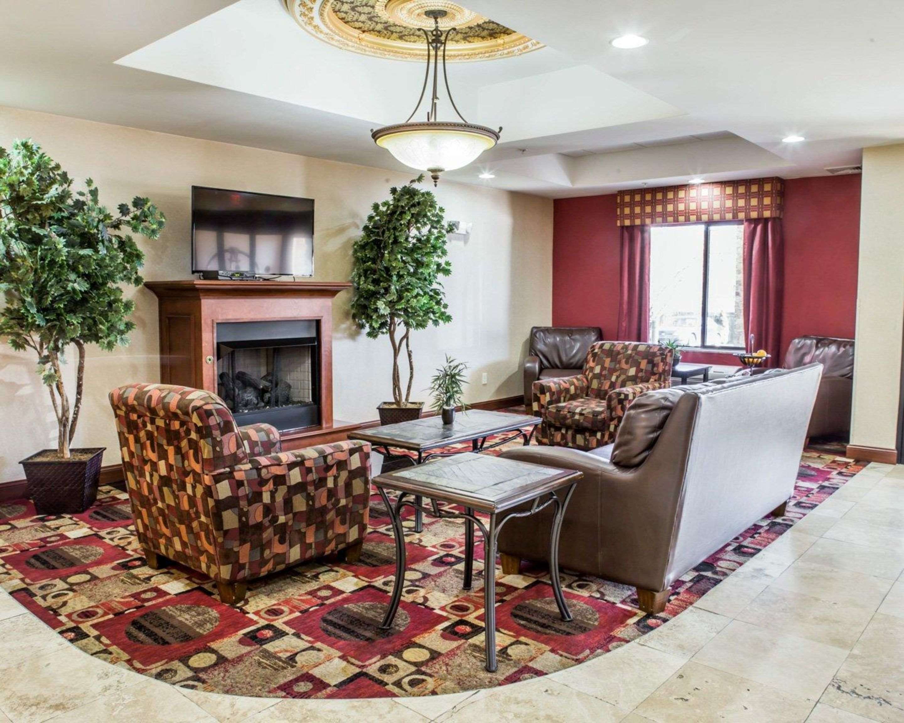Lobby with fireplace | Fairfield Inn & Suites by Marriott Greensboro Coliseum Area