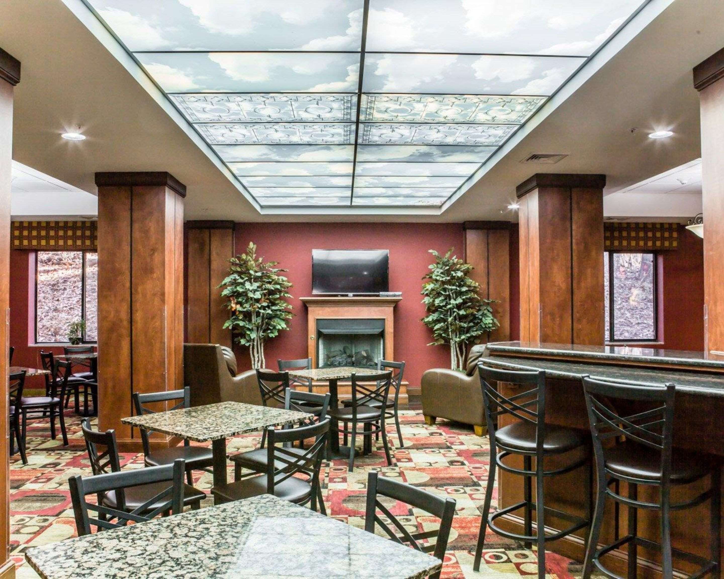 Breakfast area with fireplace | Fairfield Inn & Suites by Marriott Greensboro Coliseum Area