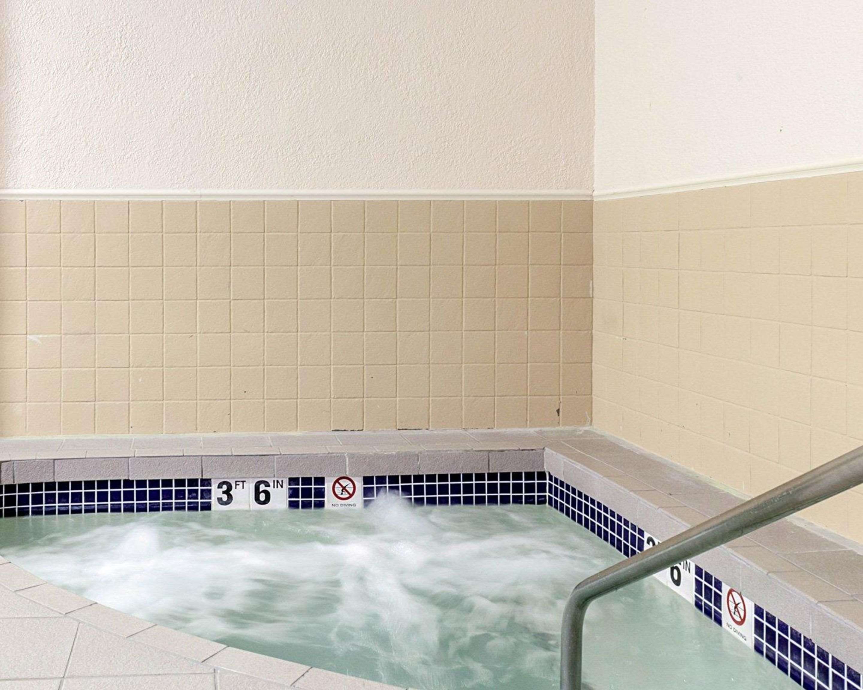 Indoor hot tub | Quality Inn & Suites Conference Center and Water Park