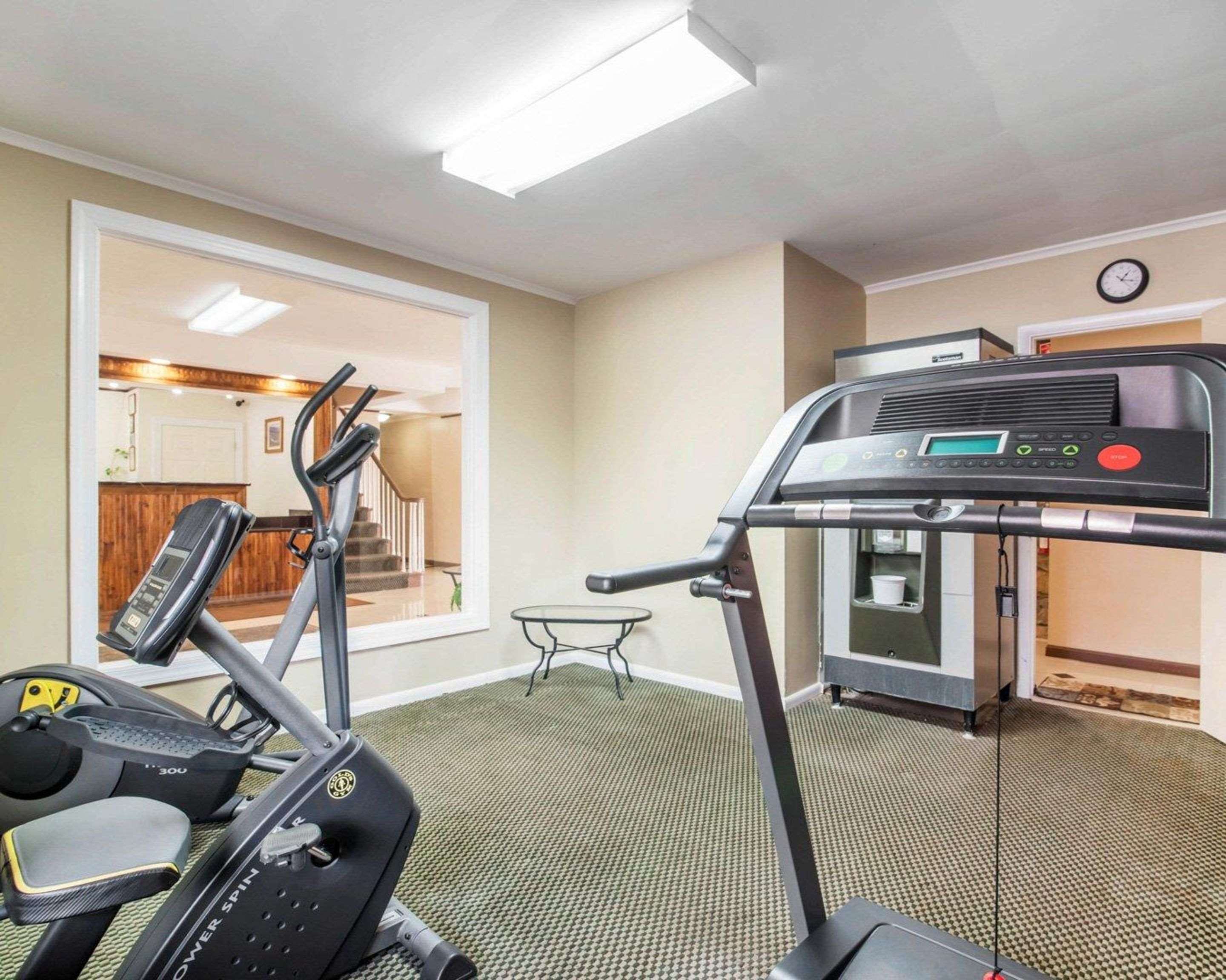 Fitness center with cardio equipment and weights | Rodeway Inn Skytop