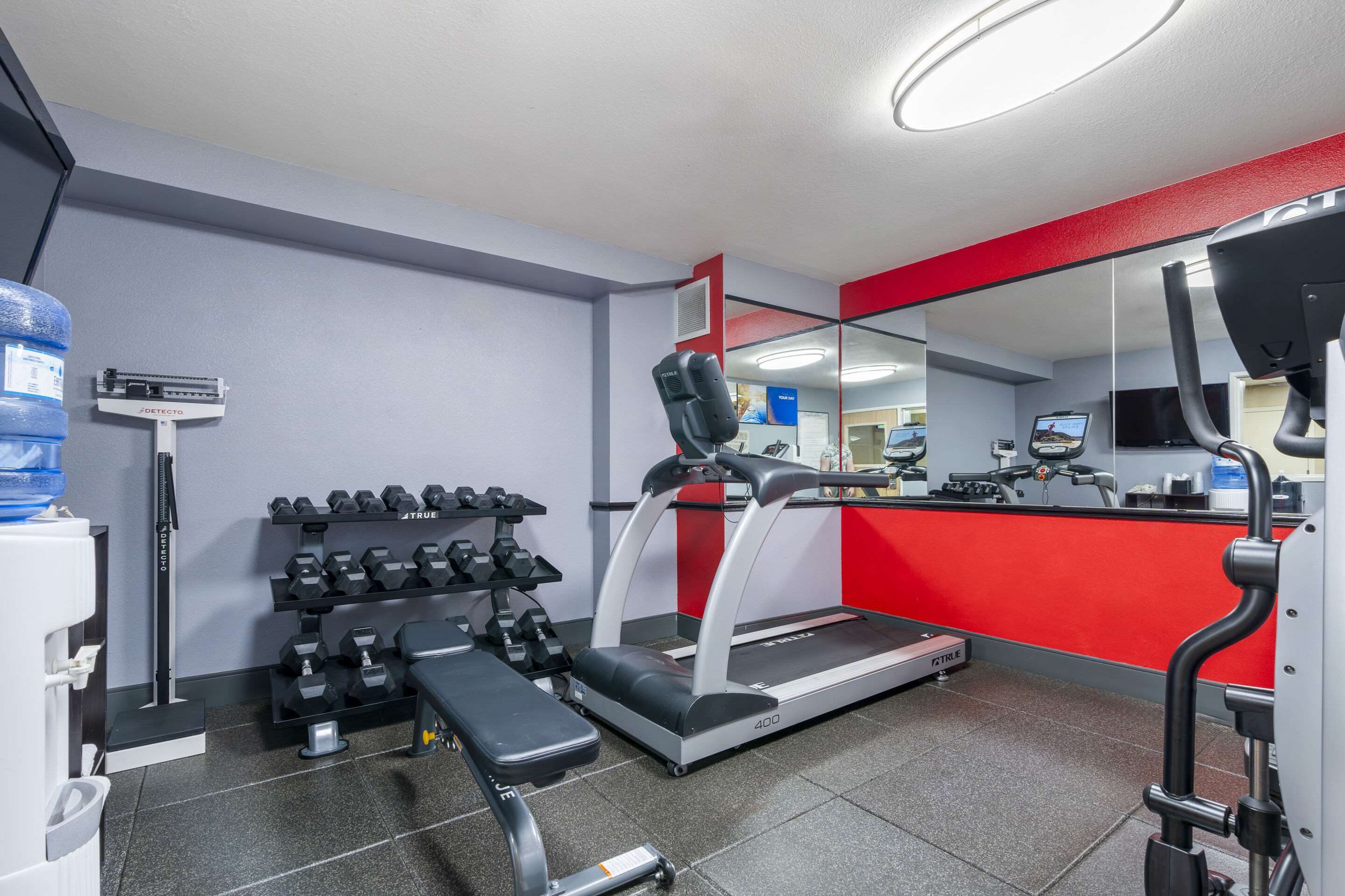 Exercise room with cardio equipment and weights | Comfort Inn Troutdale - Portland East