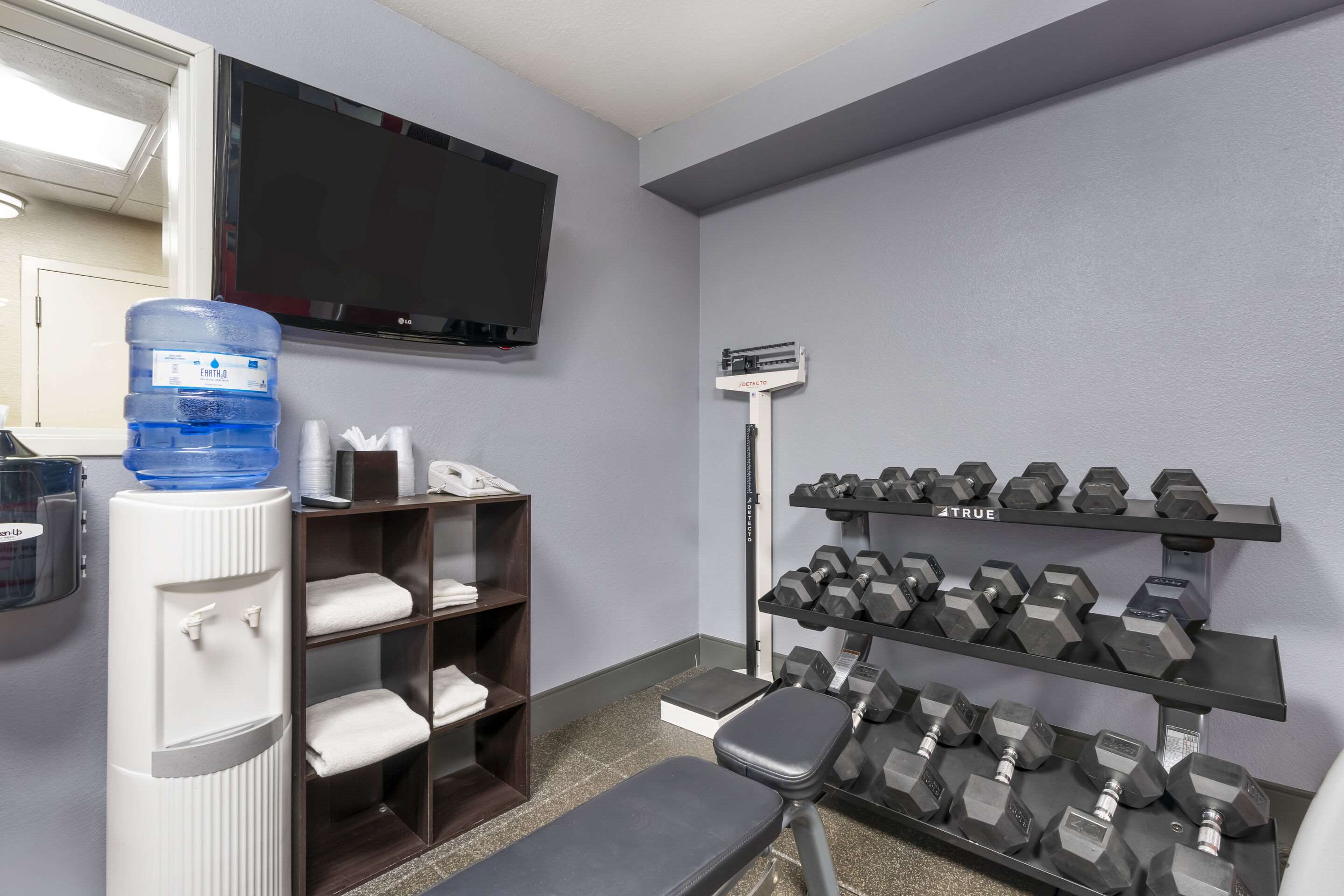 Exercise room with cardio equipment and weights | Comfort Inn Troutdale - Portland East