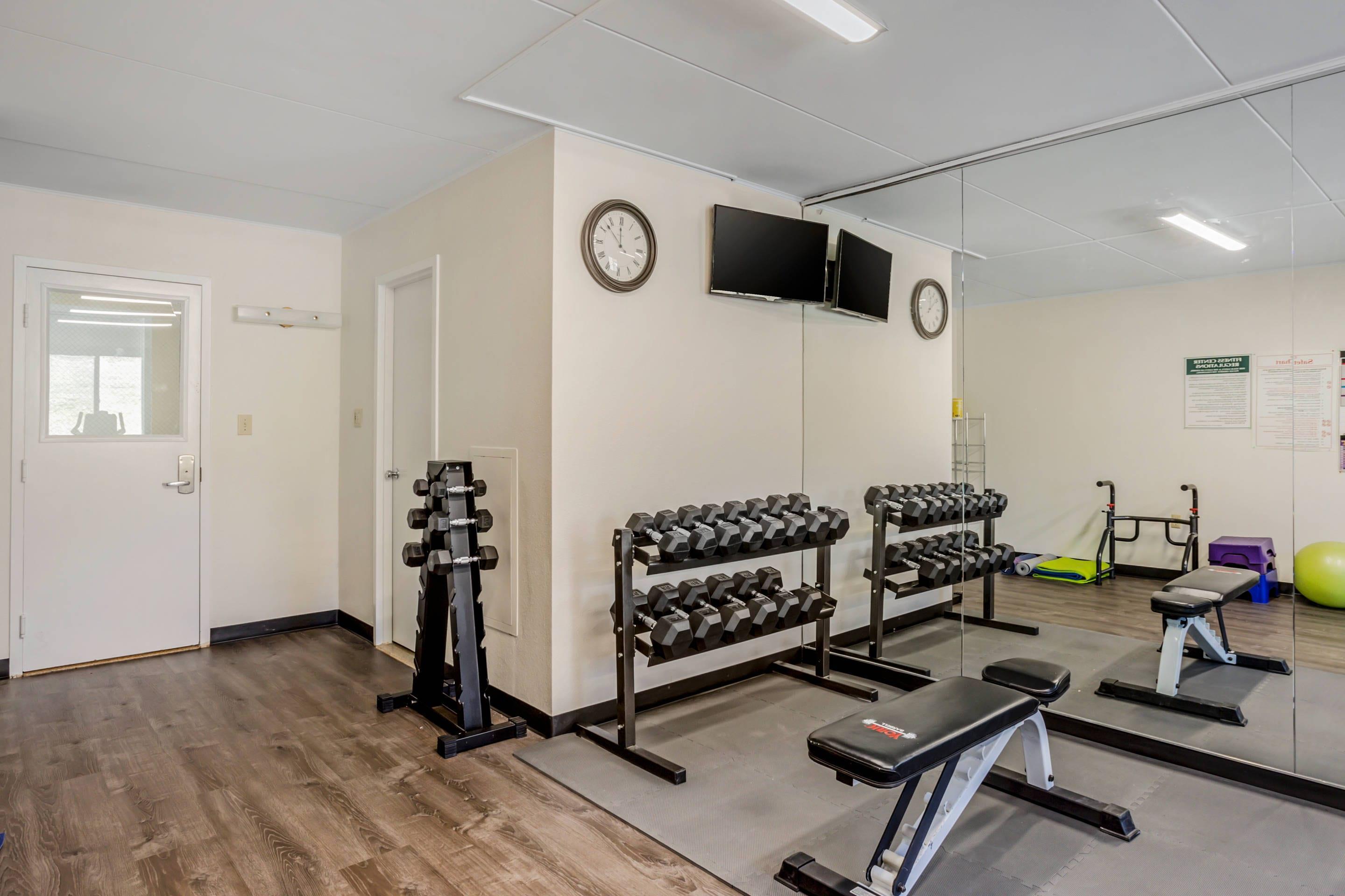 Exercise room with cardio equipment and weights | Quality Inn Riverview Enola-Harrisburg