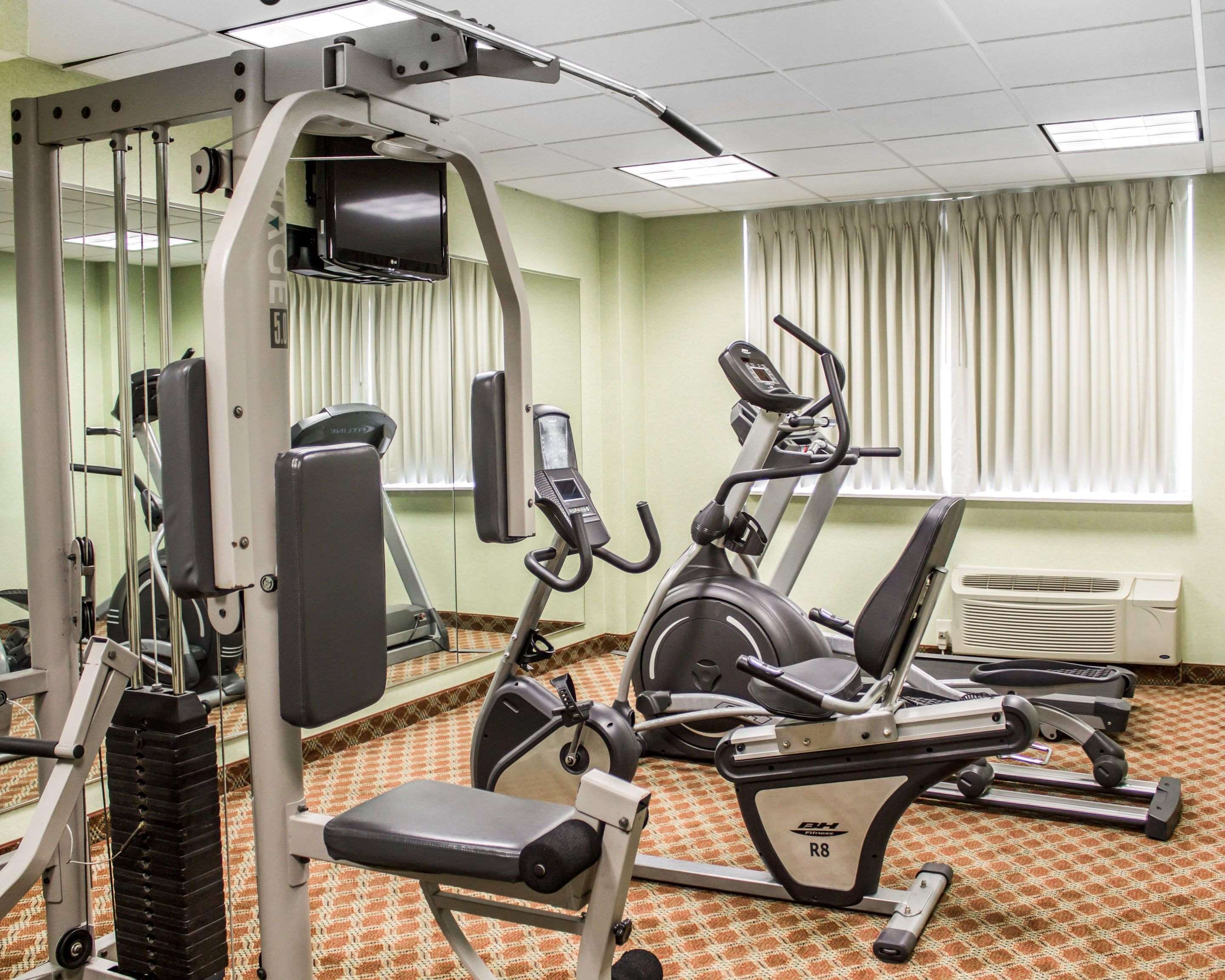 Exercise room with cardio equipment and weights