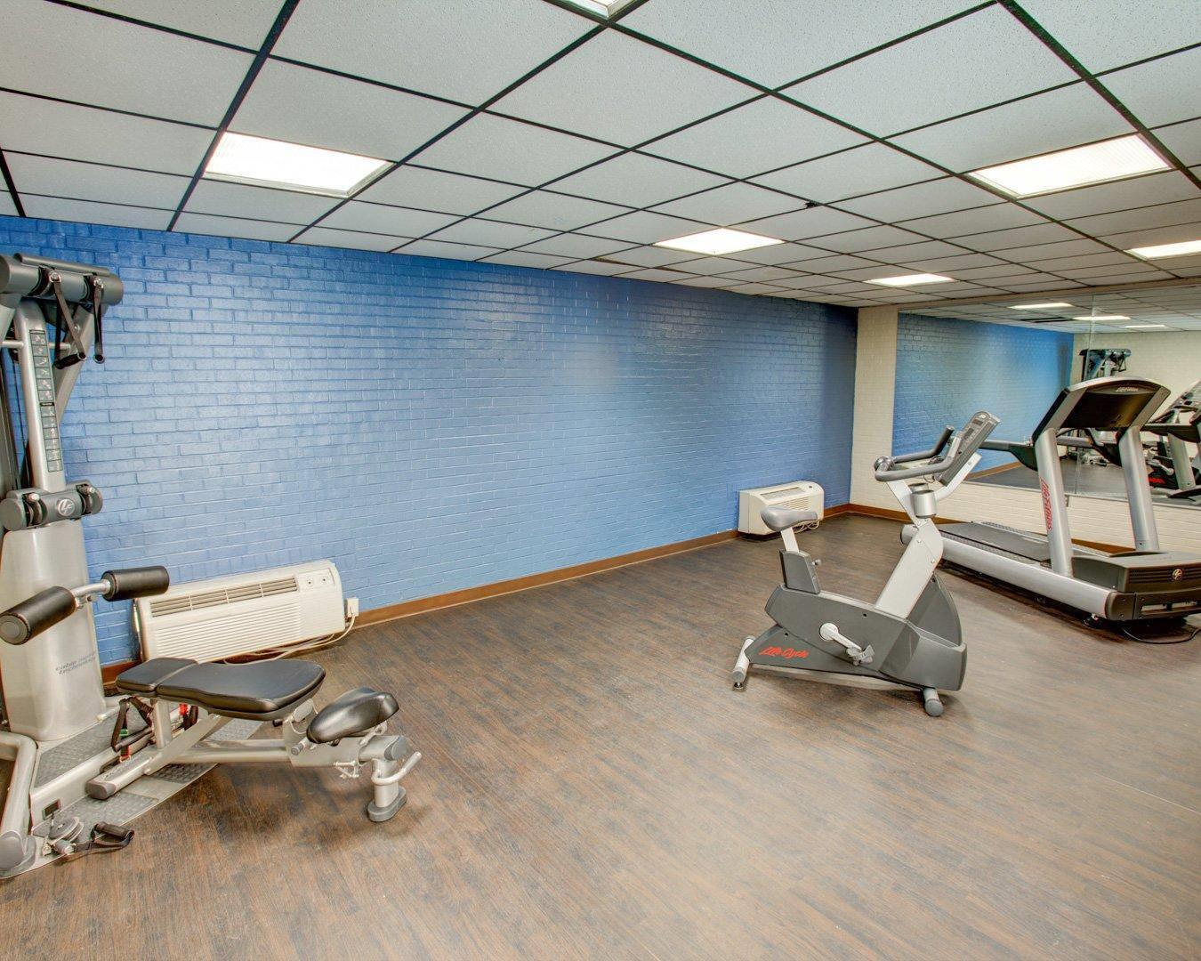 Fitness center with cardio equipment and weights | Comfort Inn Conference Center