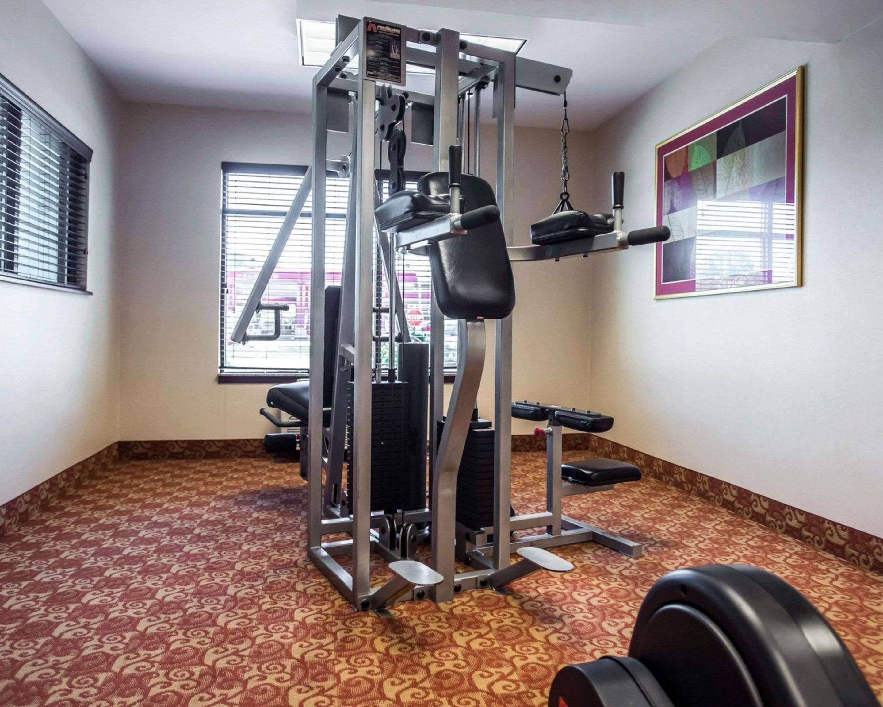 Exercise room with cardio equipment and weights