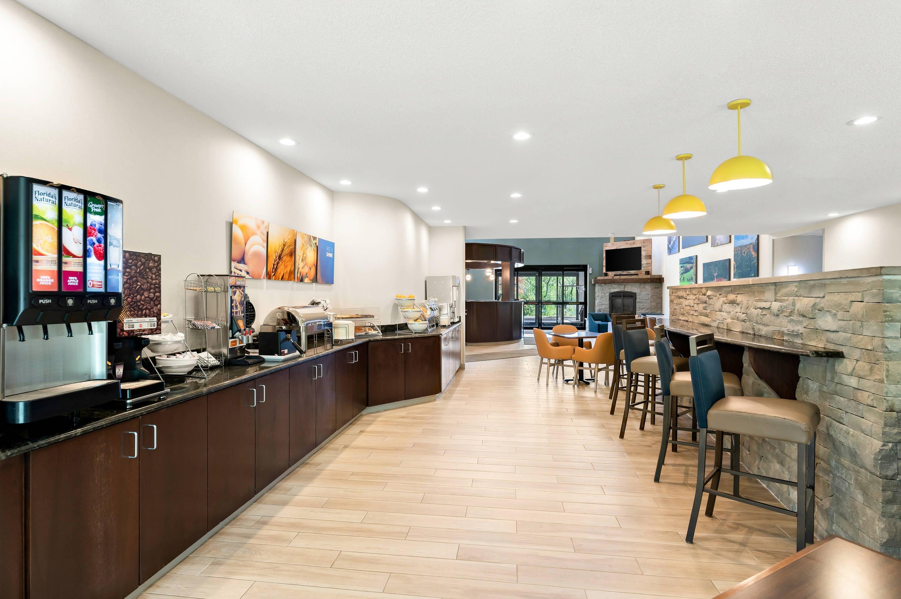 Enjoy breakfast in this seating area | Comfort Inn & Suites Tunkhannock