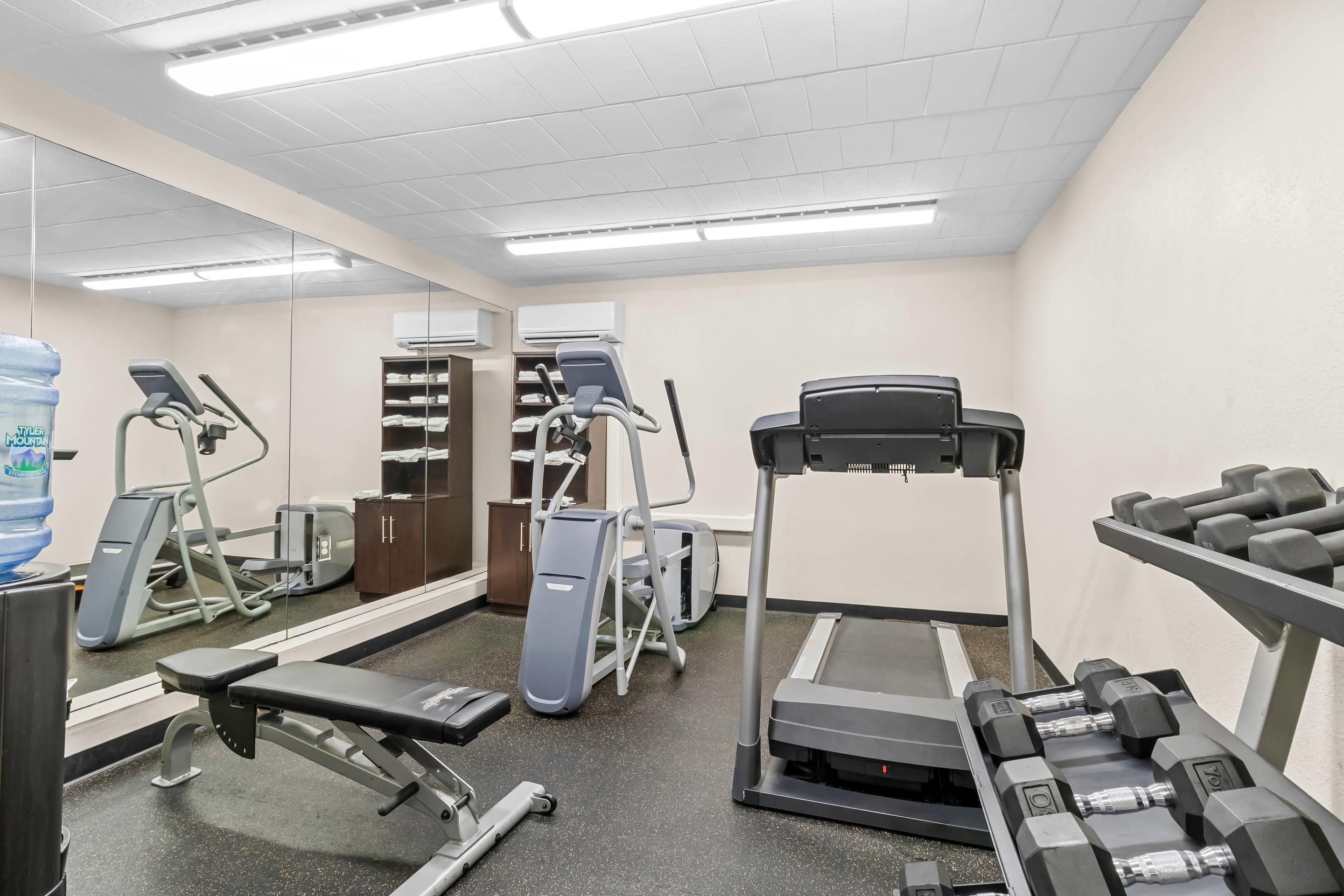 Exercise room with cardio equipment and weights | Clarion Inn Pittsburgh Cranberry