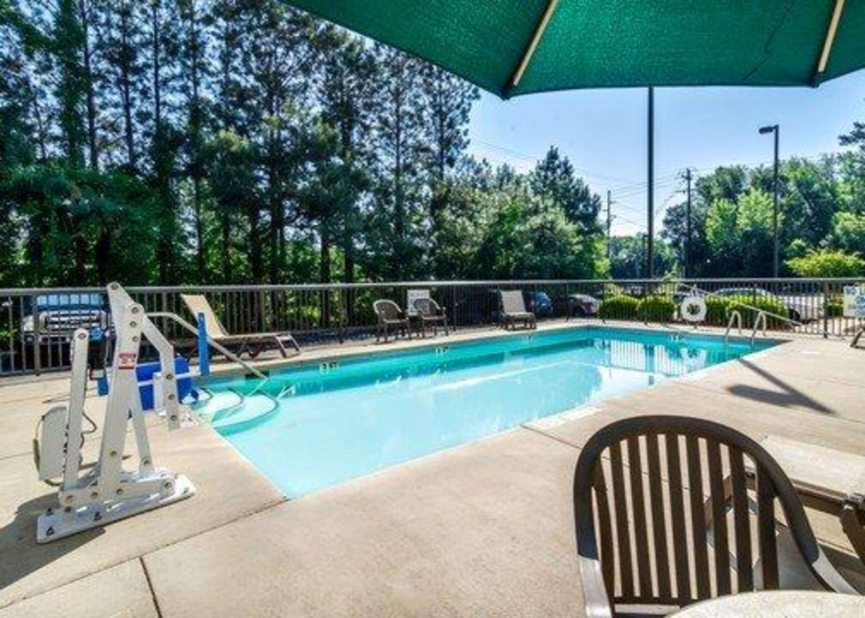 Outdoor pool with sundeck | Sleep Inn Airport West Columbia