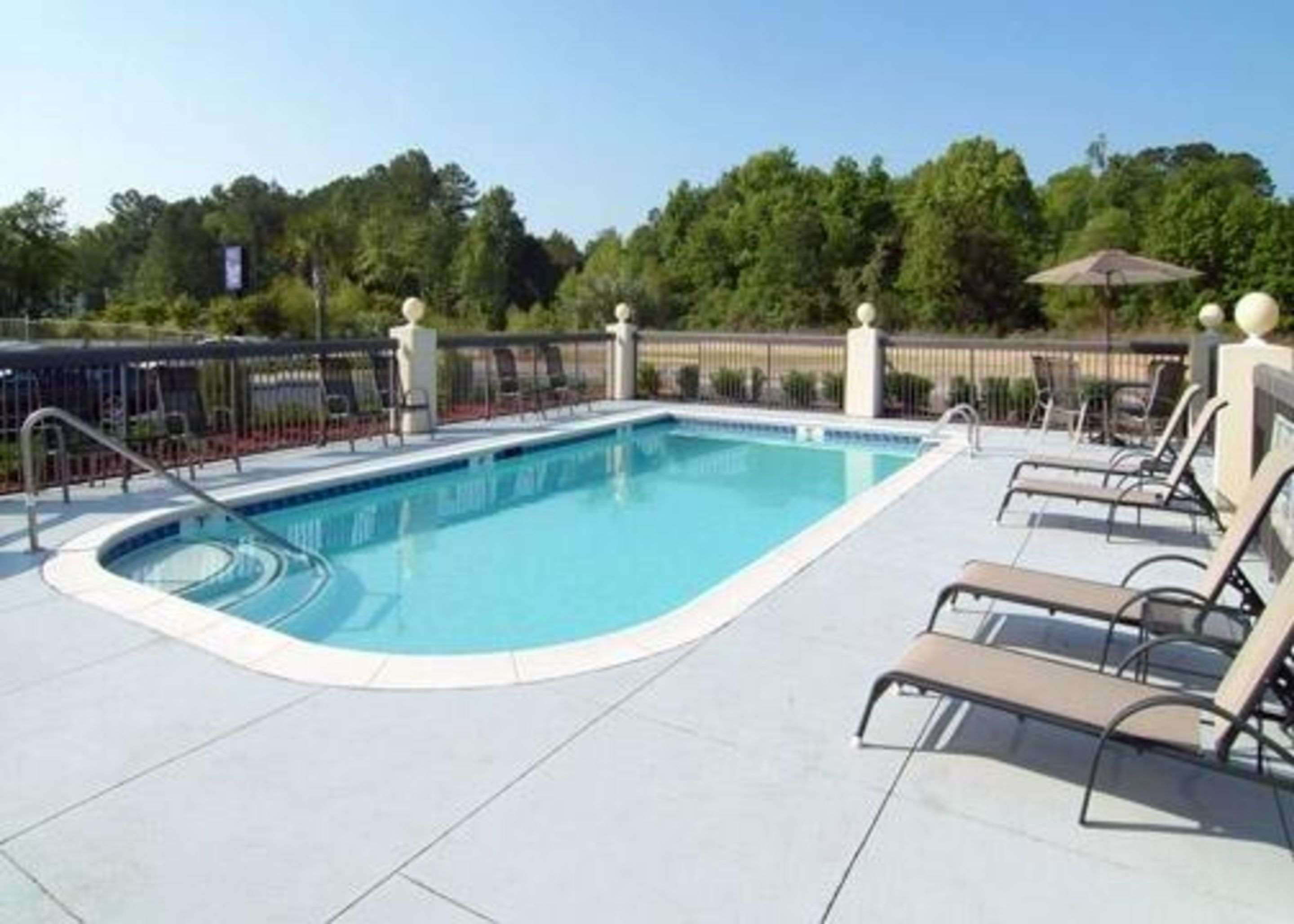 Outdoor pool with sundeck | Sleep Inn Walterboro I-95