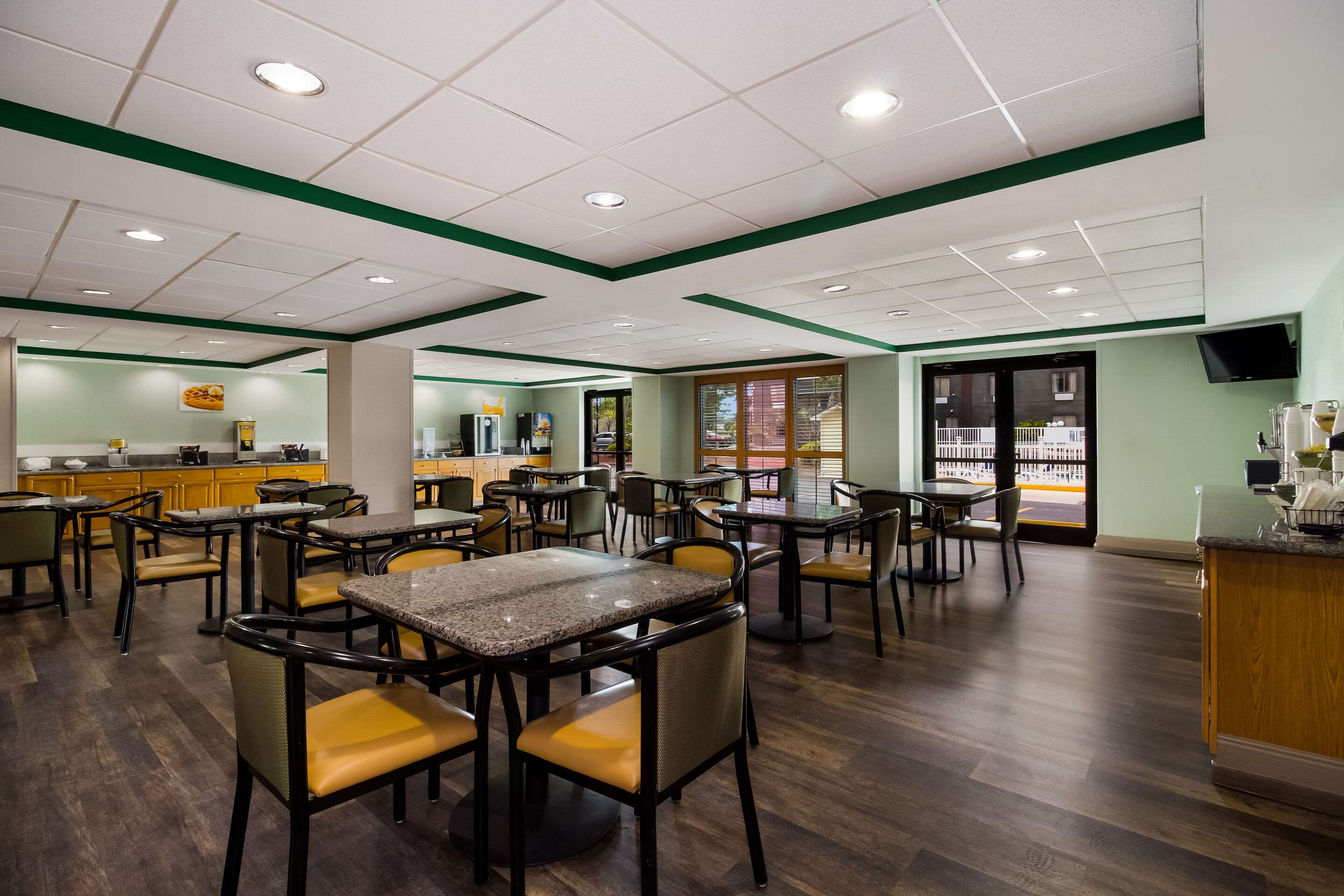 Enjoy breakfast in this seating area | Quality Inn & Suites North Myrtle Beach
