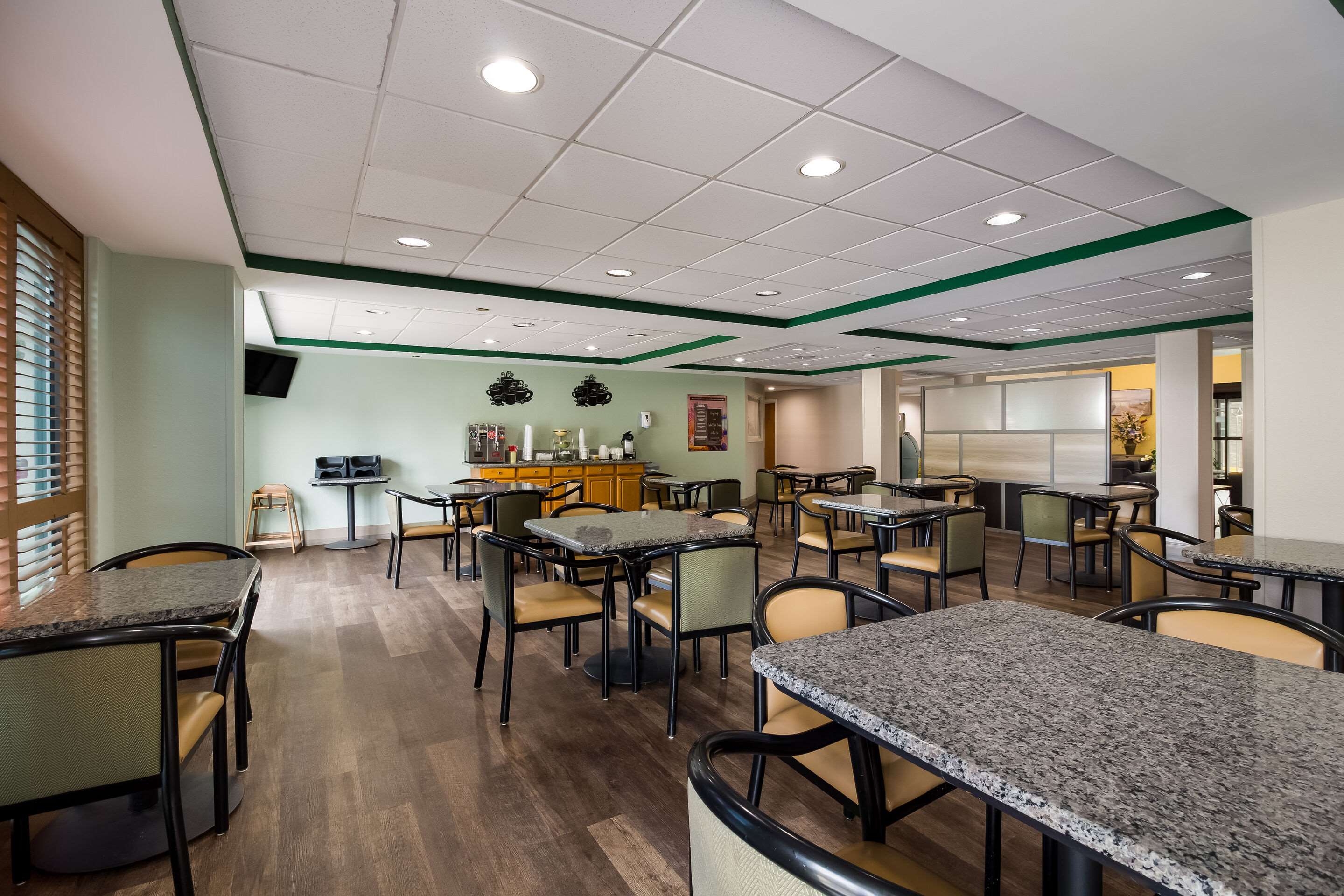 Enjoy breakfast in this seating area | Quality Inn & Suites North Myrtle Beach