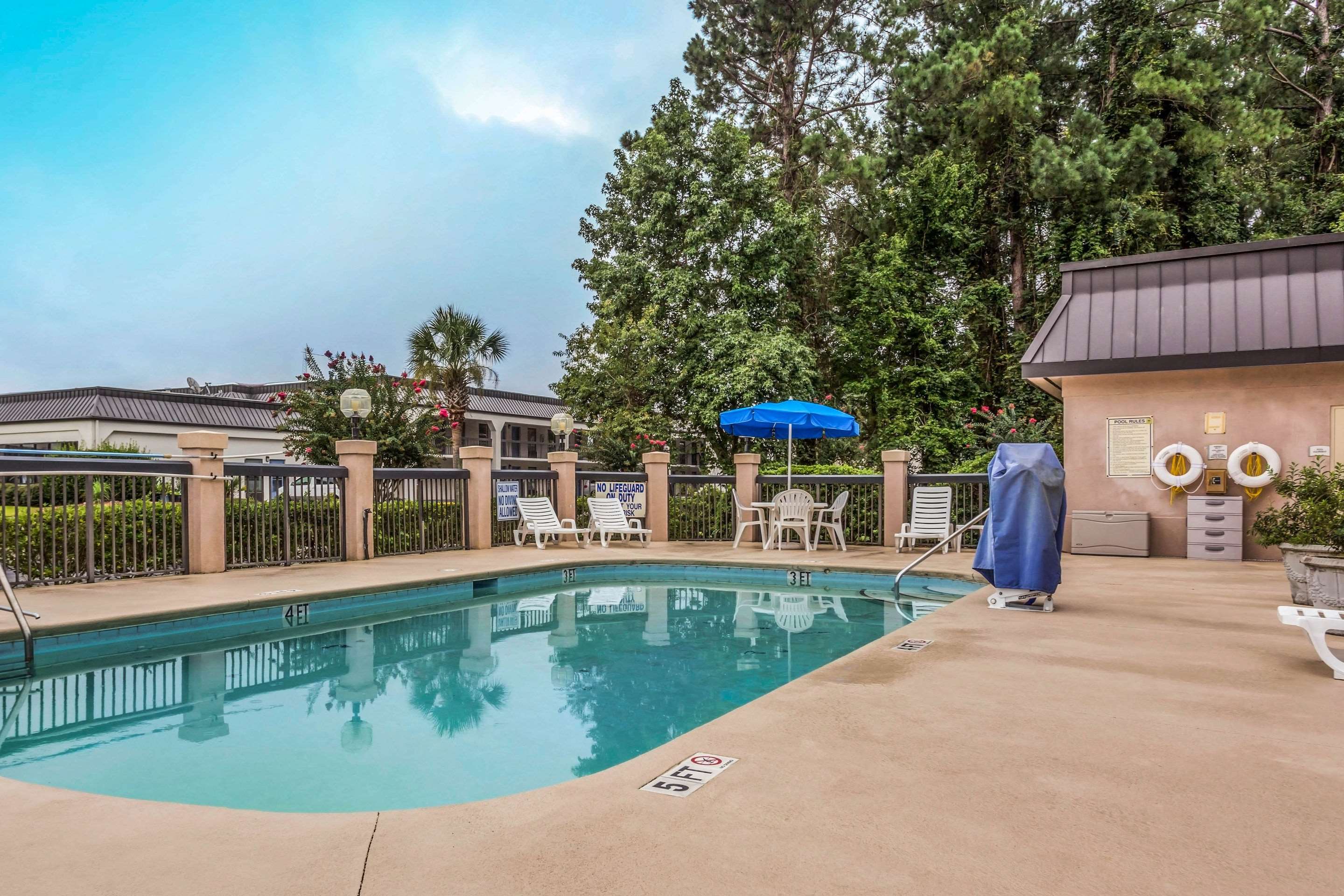 Relax by the pool | Quality Inn