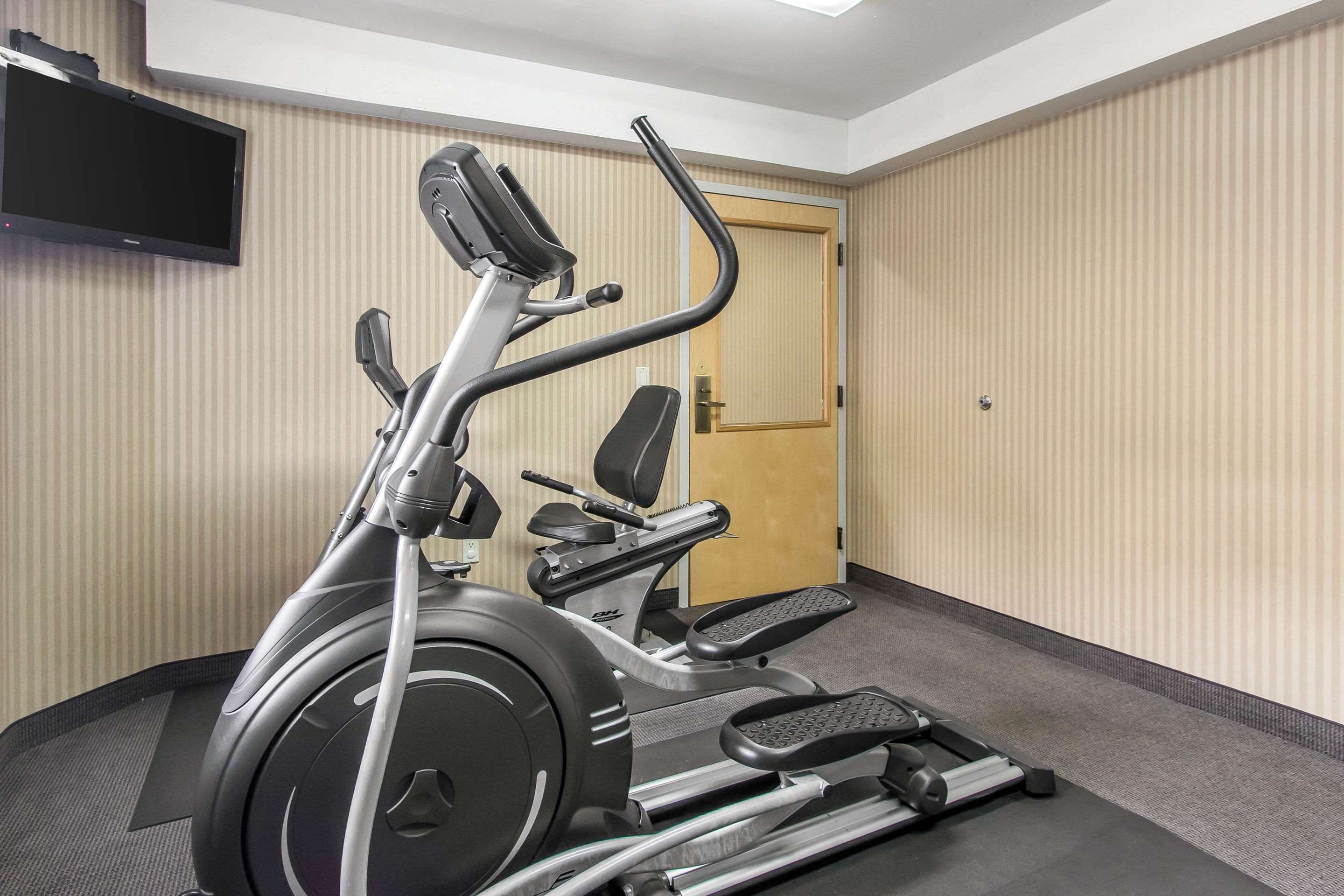 Exercise room with cardio equipment | Sleep Inn