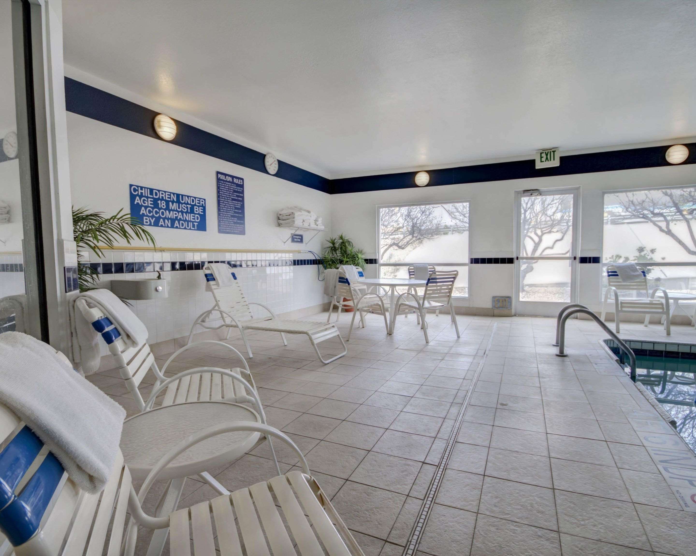Relax by the pool | Quality Suites University