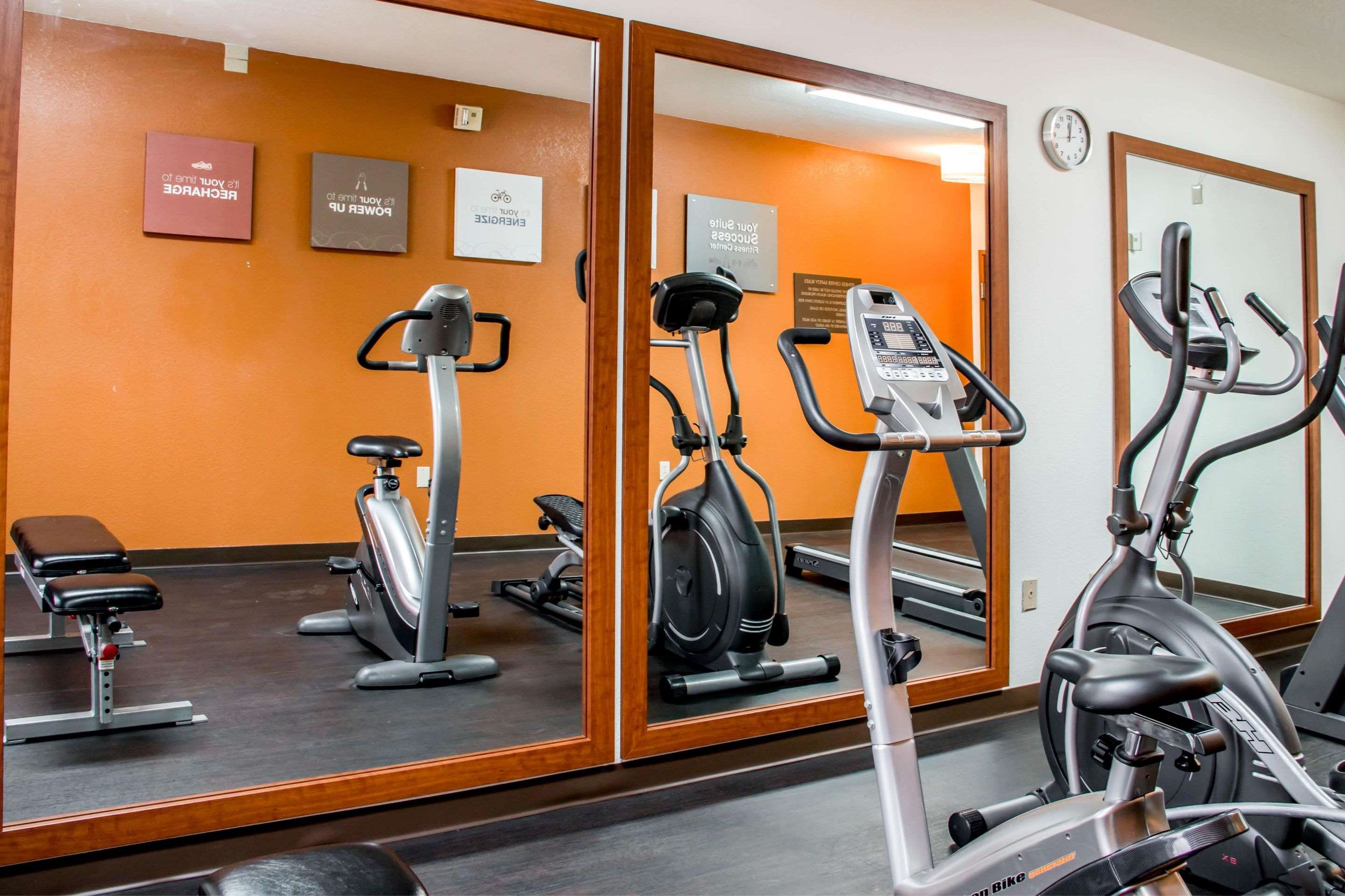 Exercise room with cardio equipment and weights