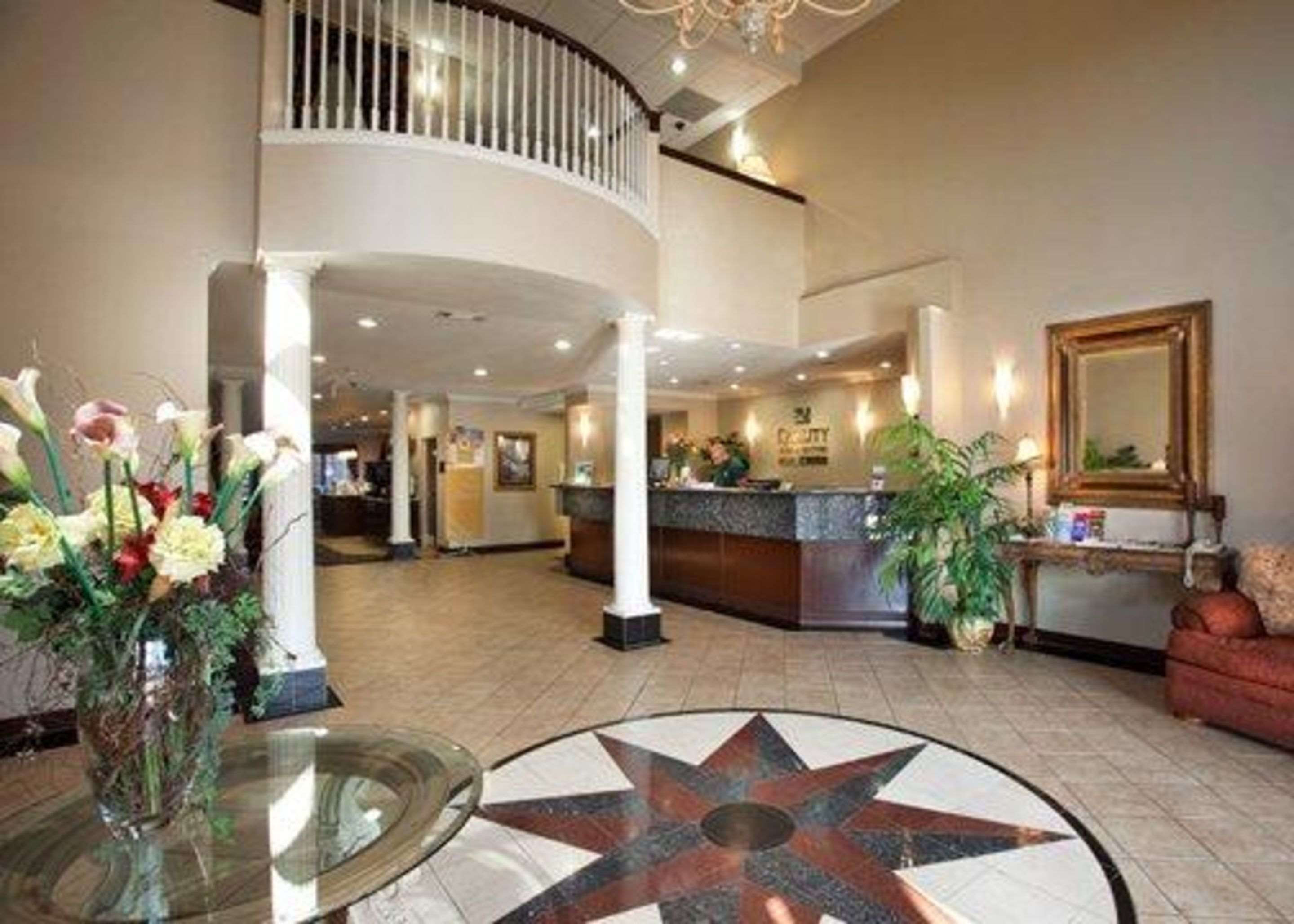 Front desk with friendly staff | Quality Inn & Suites, Near University