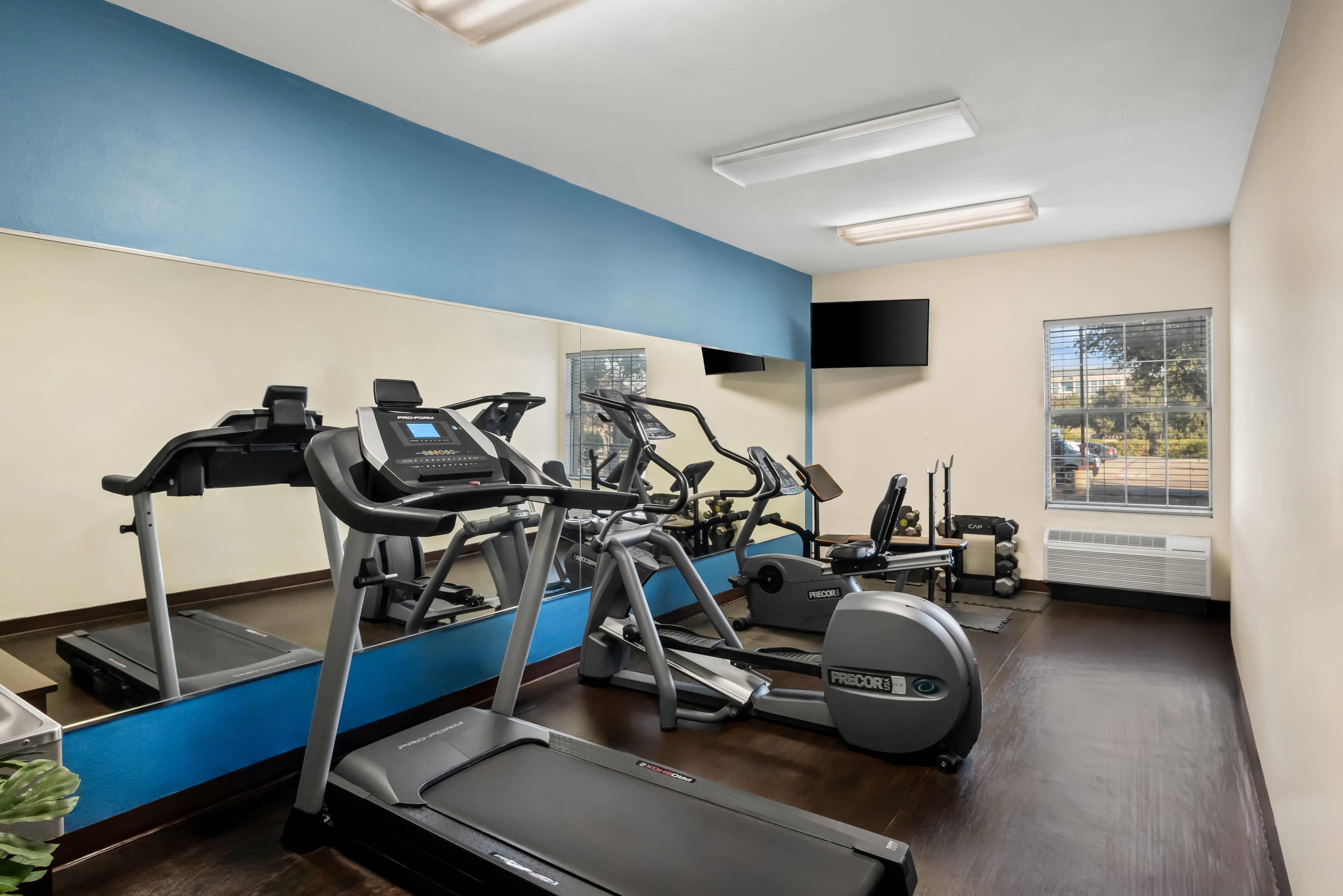 Exercise room with cardio equipment | Quality Suites Las Colinas Center