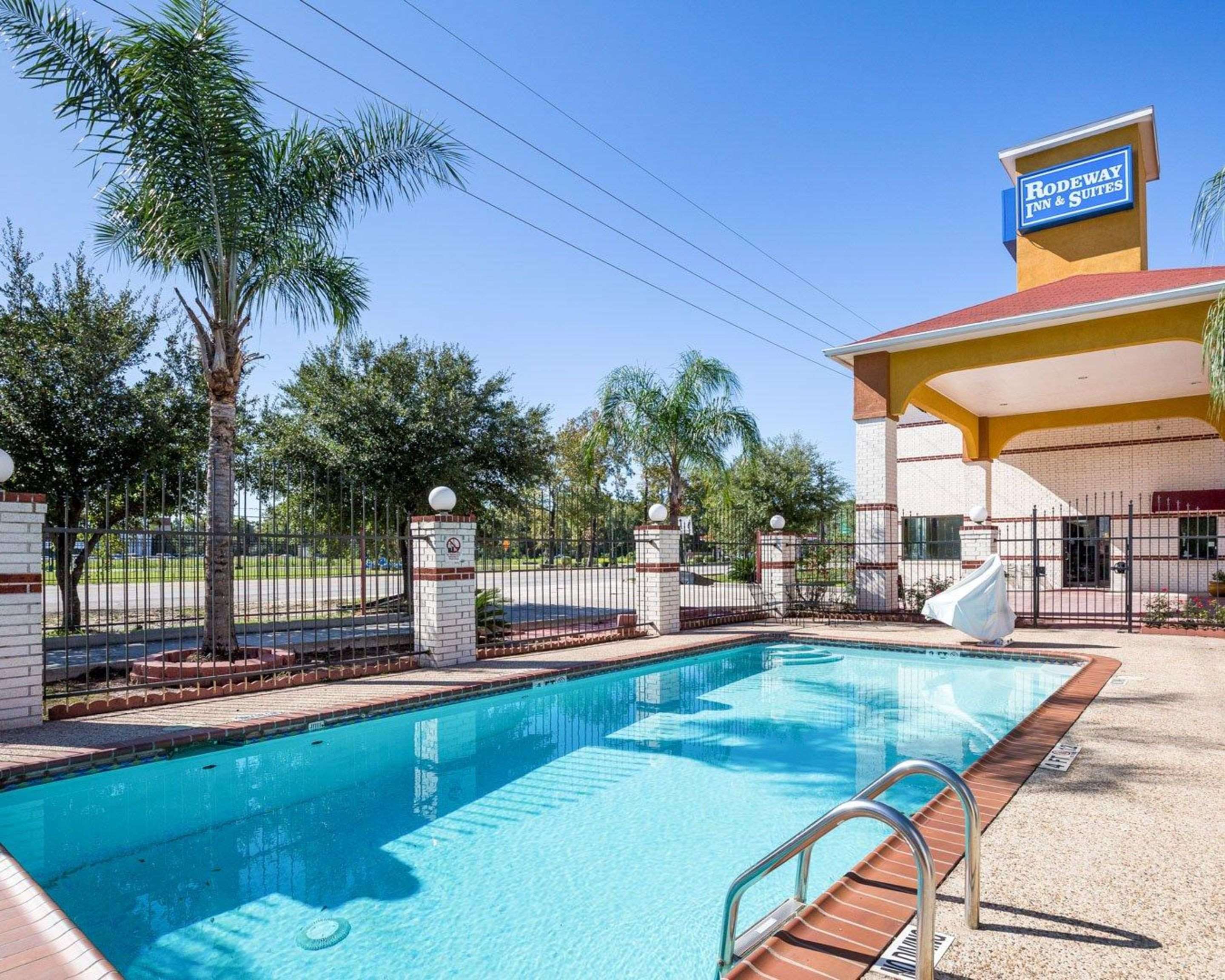 Outdoor pool with sundeck | Rodeway Inn & Suites Humble, TX