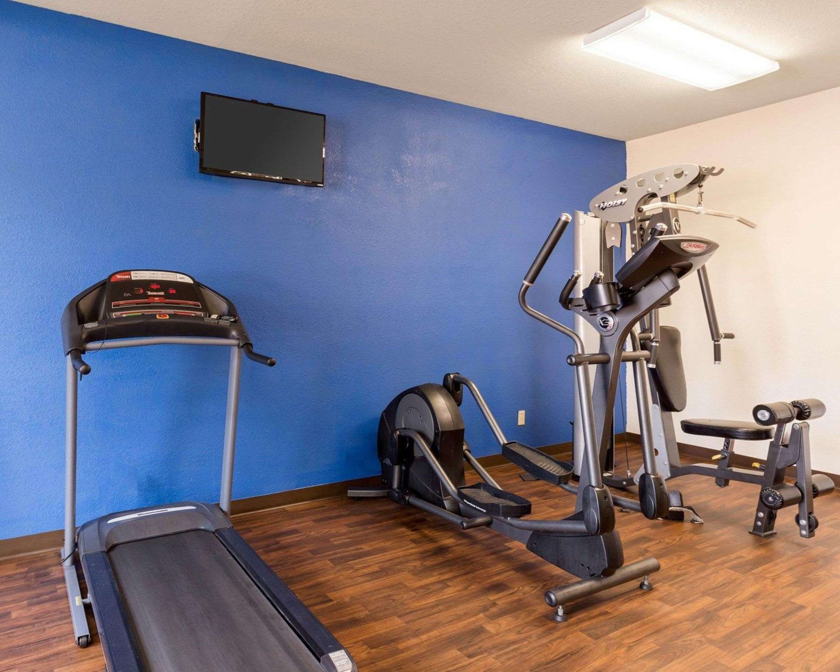 Exercise room with television | Quality Suites