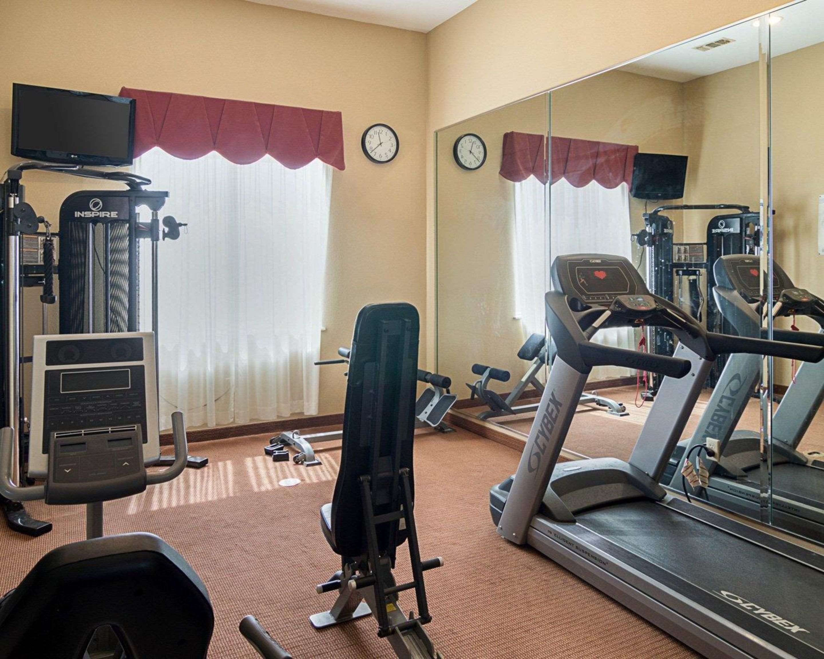 Fitness center with cardio equipment and weights | Comfort Inn & Suites