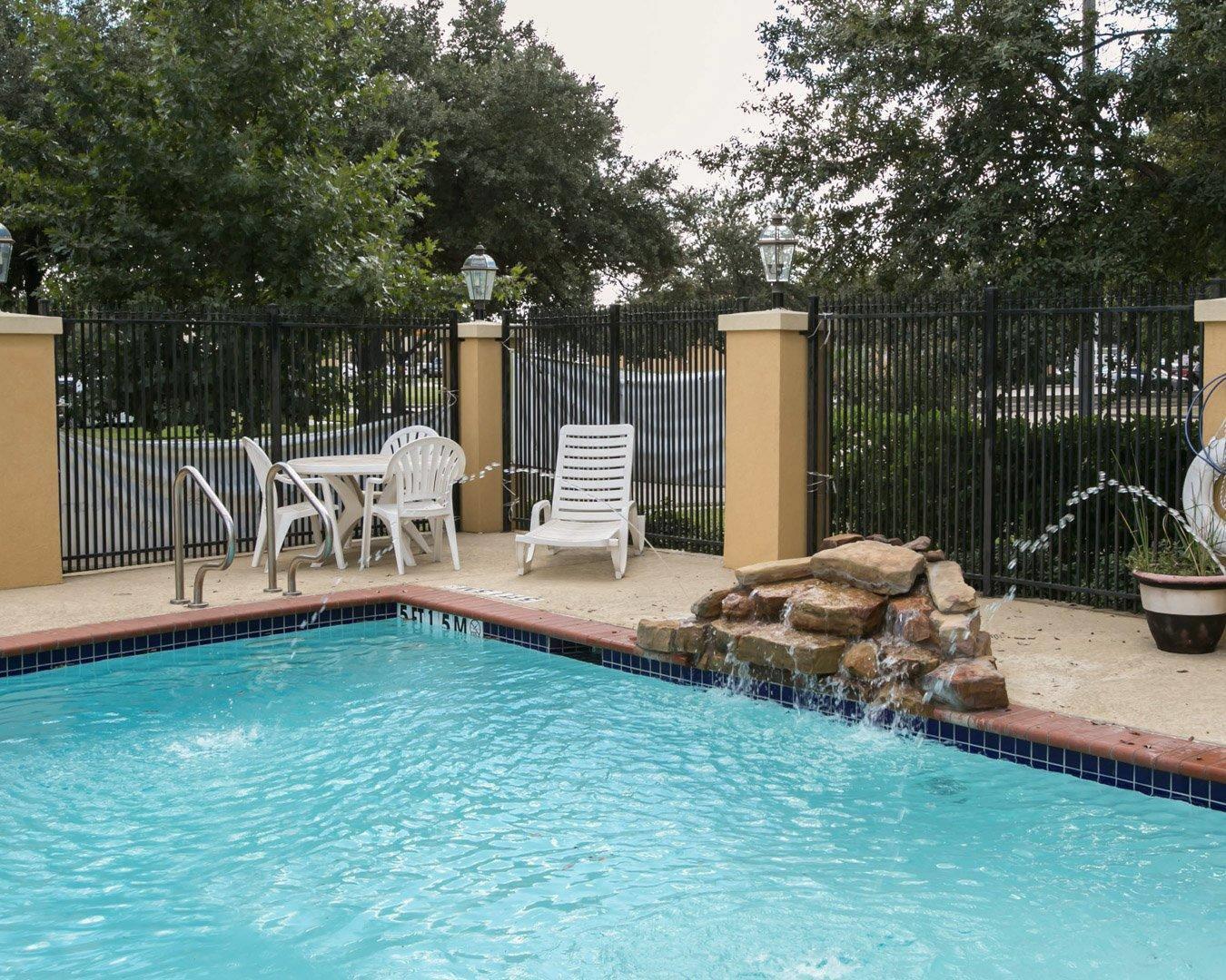 Outdoor pool with waterfall