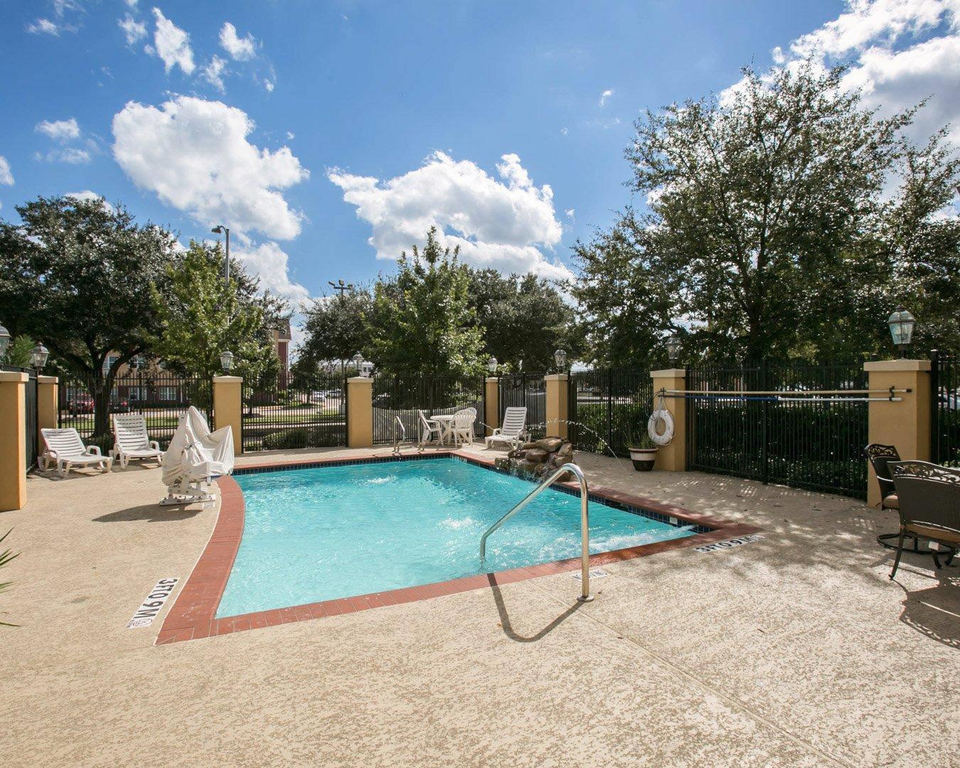 Outdoor pool with sitting area