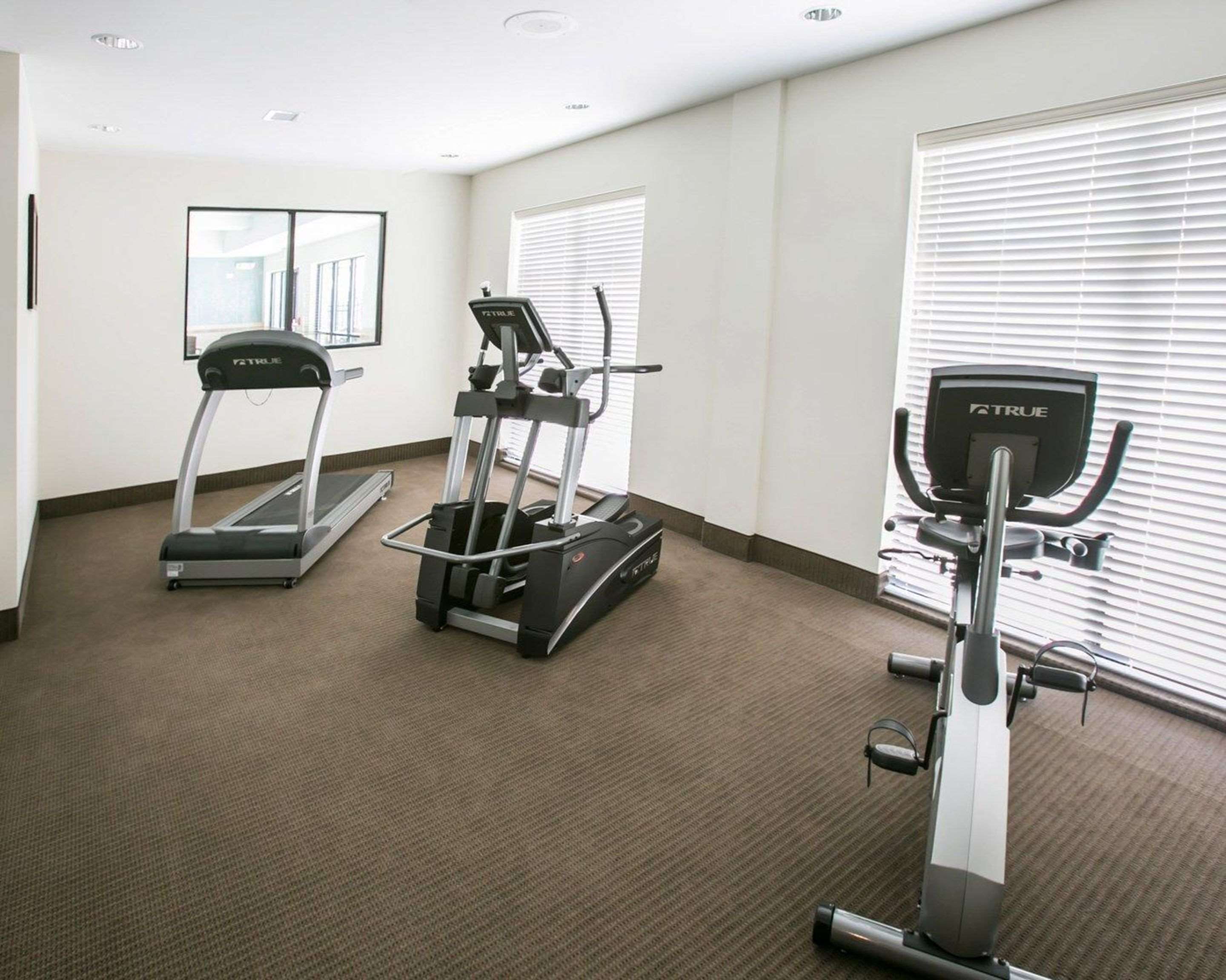 Fitness center with cardio equipment | Sleep Inn & Suites Austin North I-35