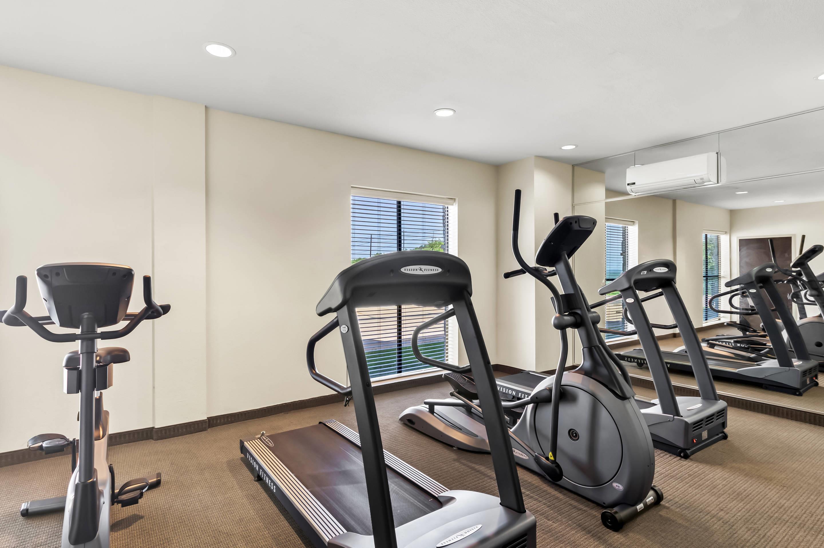 Exercise room with cardio equipment | Sleep Inn & Suites