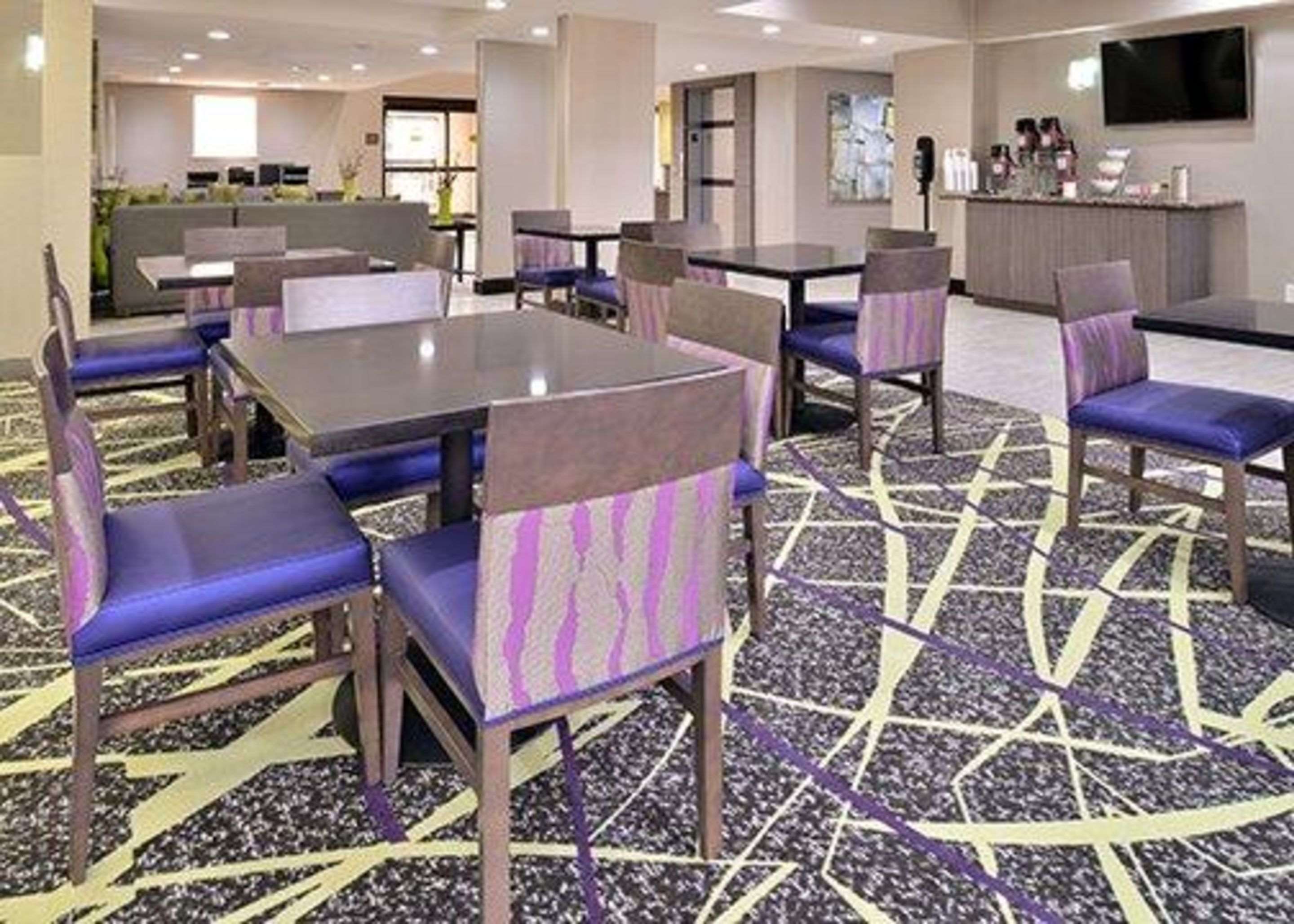 Enjoy breakfast in this seating area | Comfort Inn & Suites Frisco - Plano