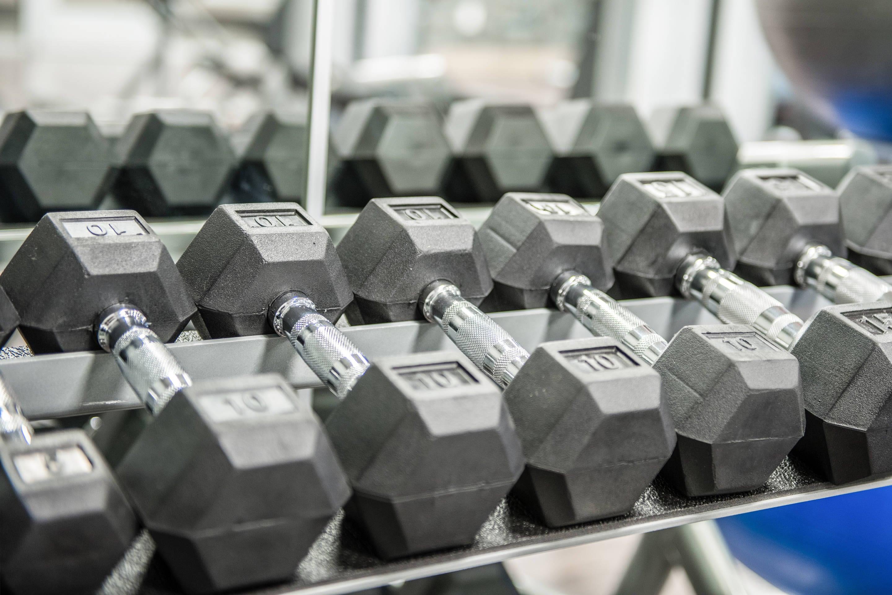 Exercise room with cardio equipment and weights | Cambria Hotel McAllen Convention Center