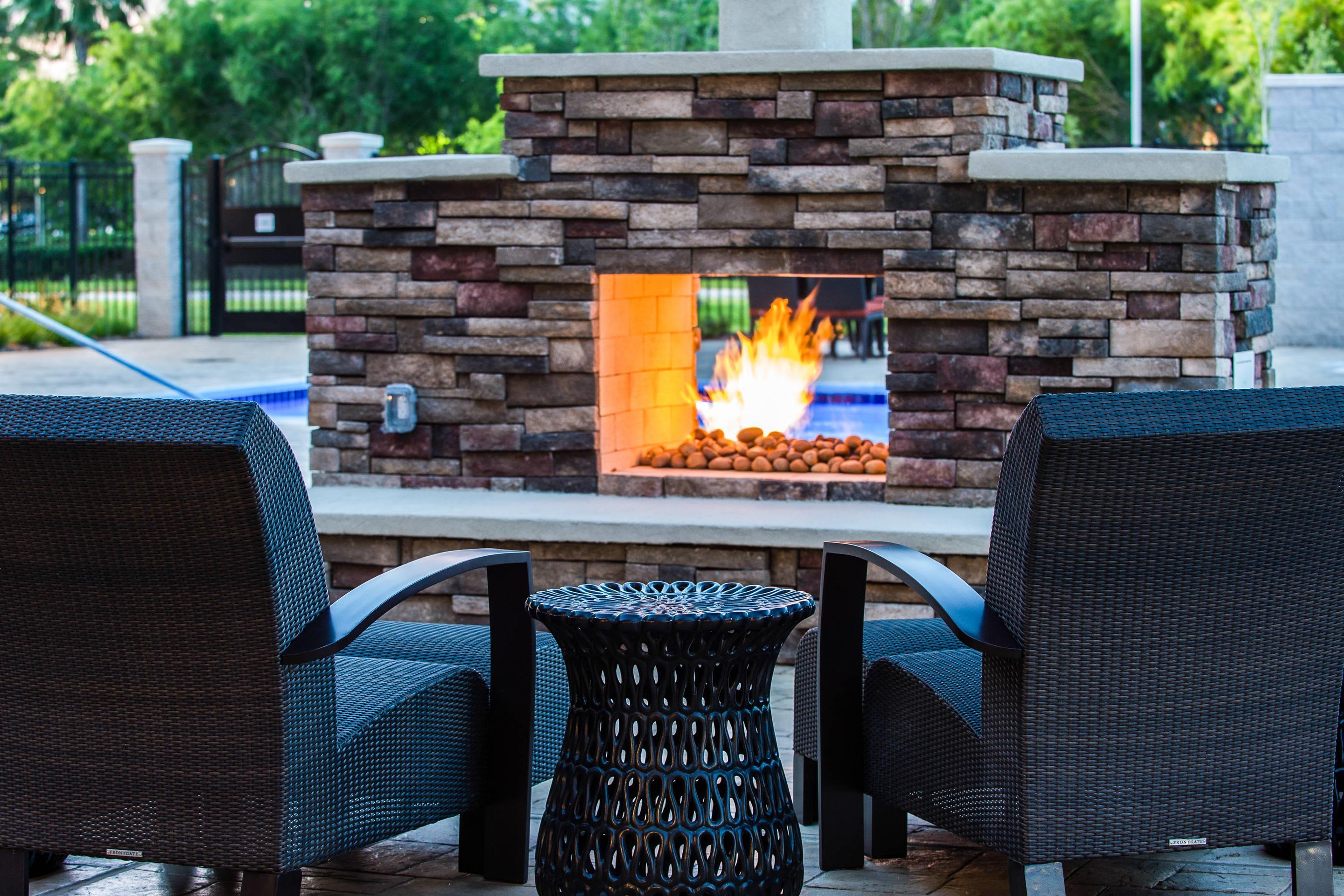 Sit by the hotel's outdoor firepit | Cambria Hotel McAllen Convention Center