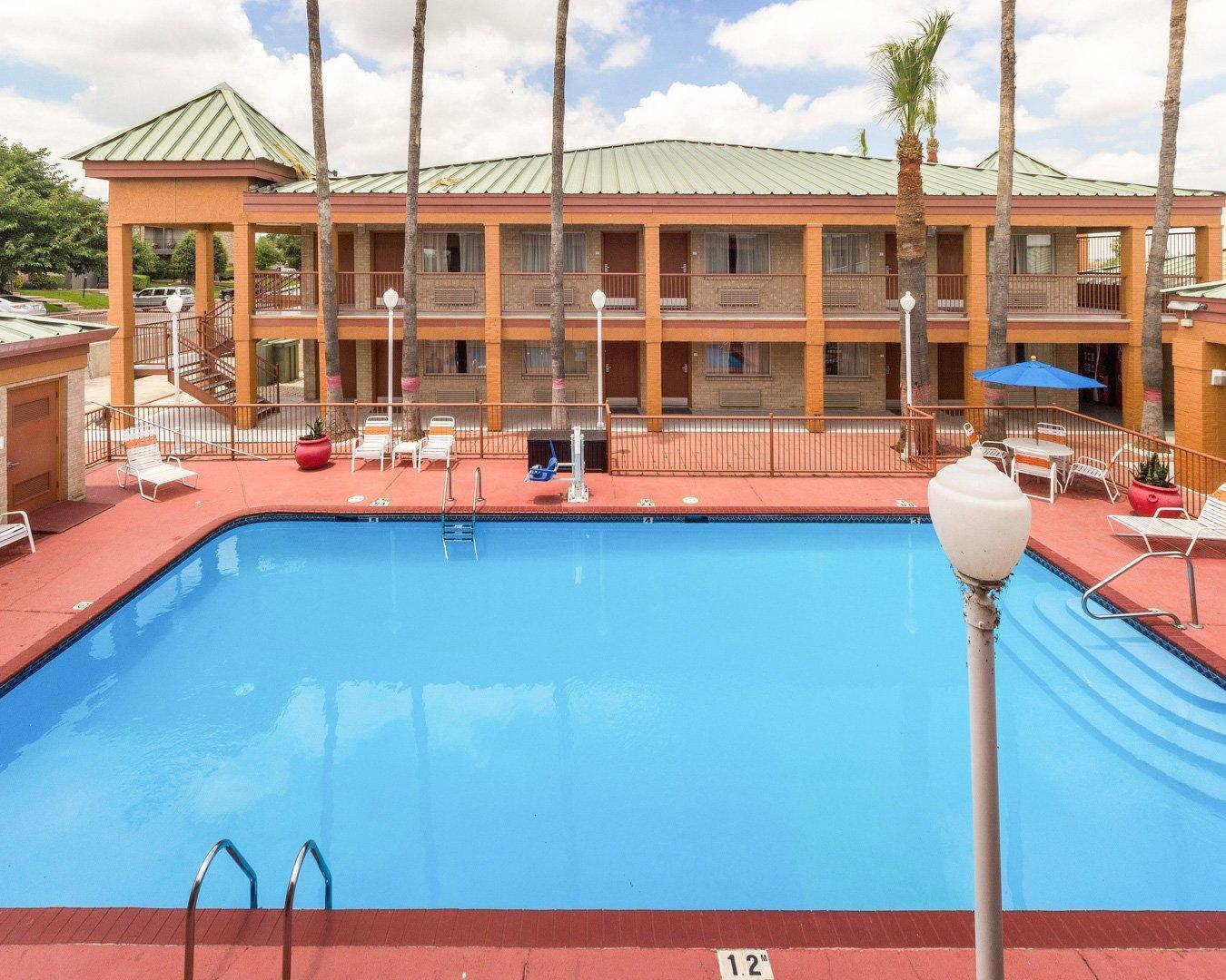 Outdoor pool with sundeck | Econo Lodge Inn & Suites Eagle Pass
