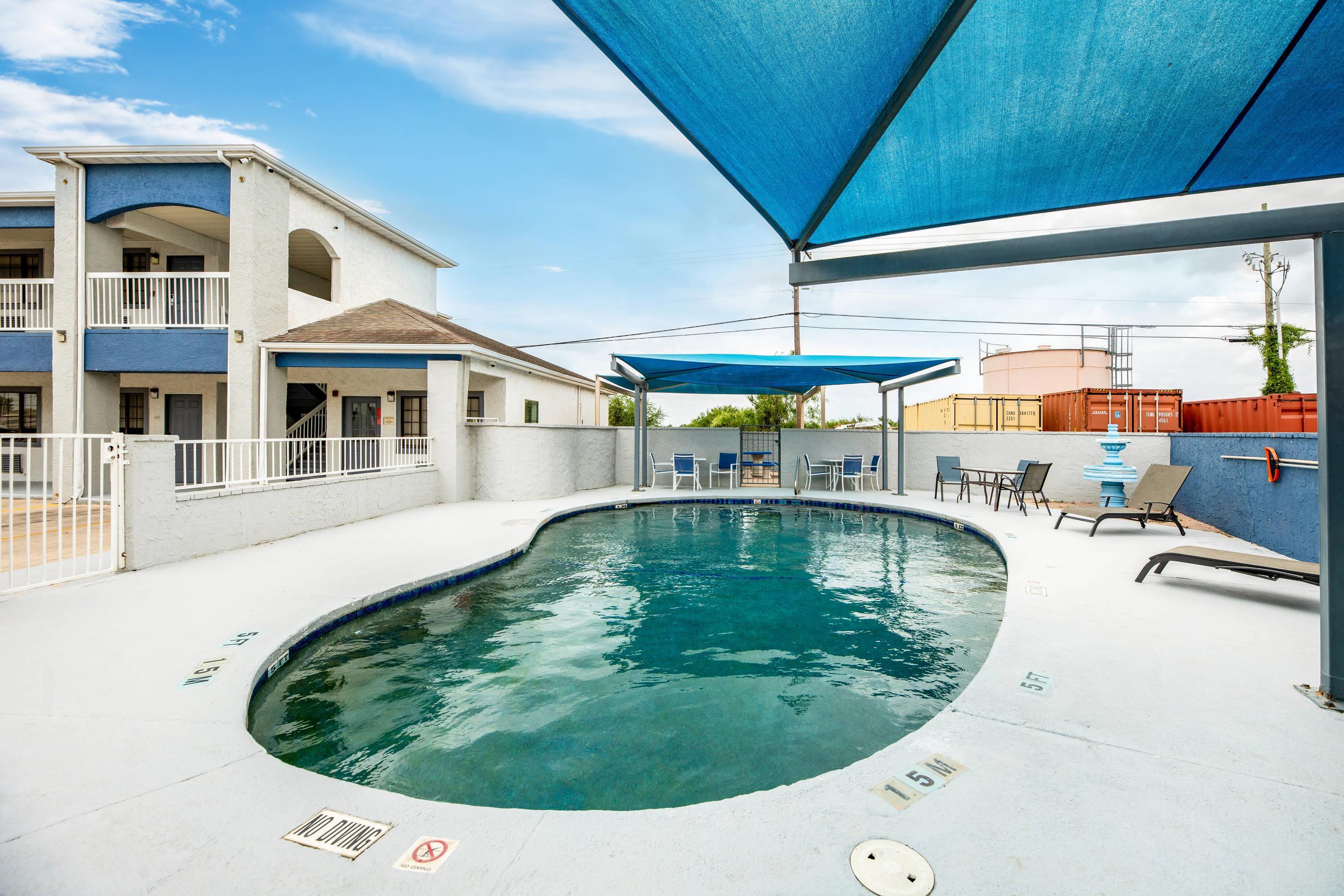 Relax by the pool | Quality Inn & Suites
