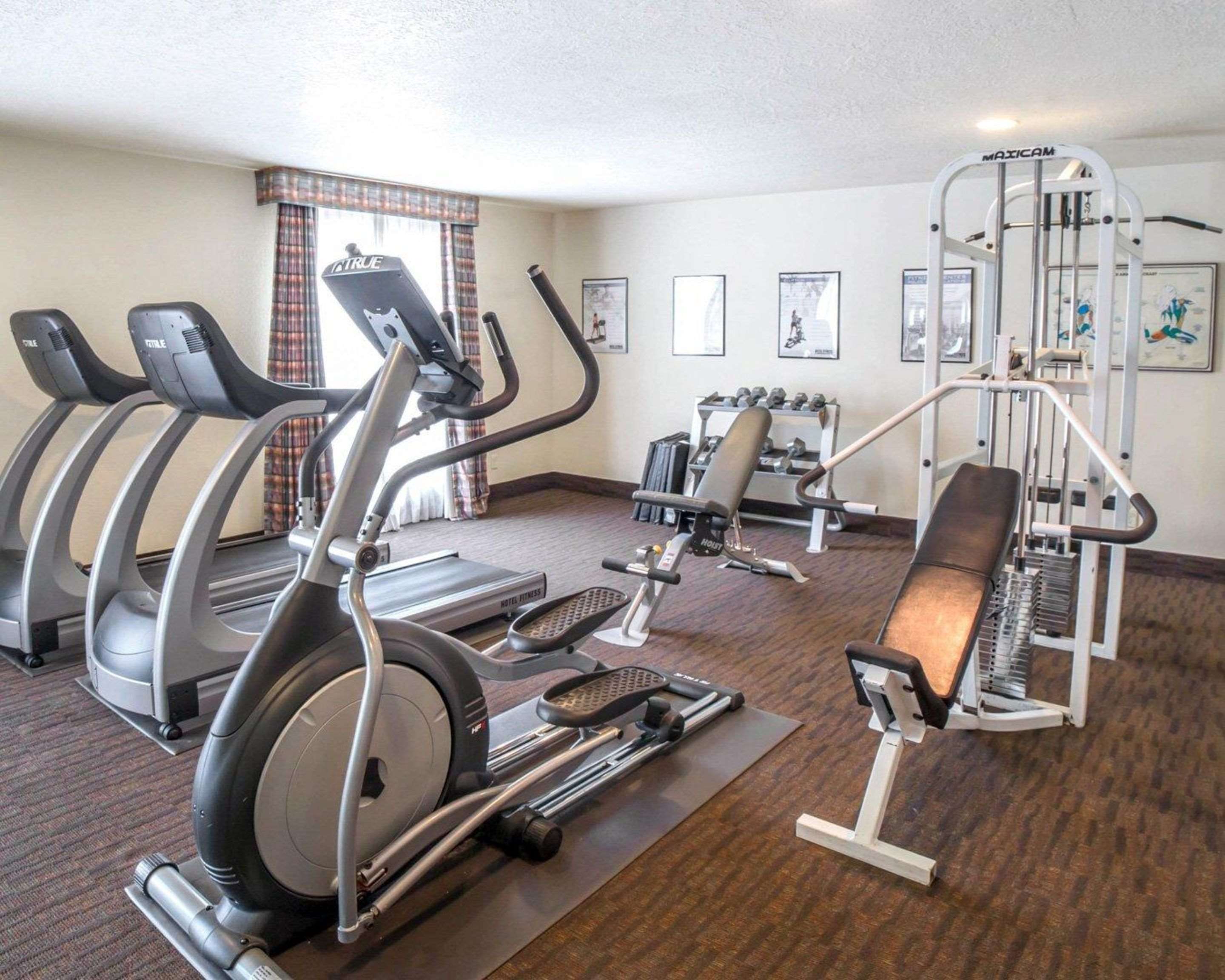 Fitness center with cardio equipment and weights | Comfort Inn Downtown